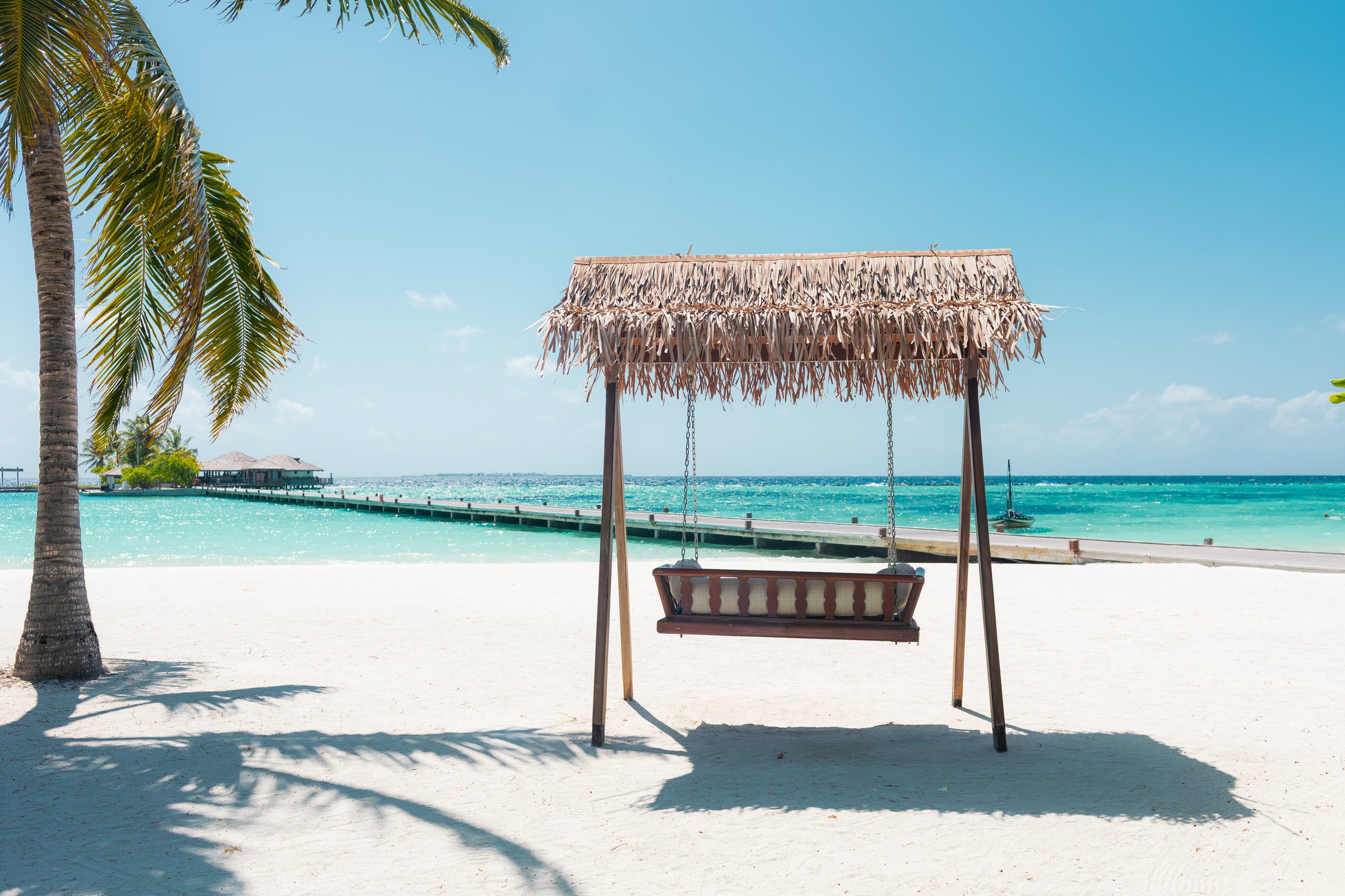 Vacation summer holidays background wallpaper - sunny tropical Caribbean paradise beach with white sand on island Thailand style with palms