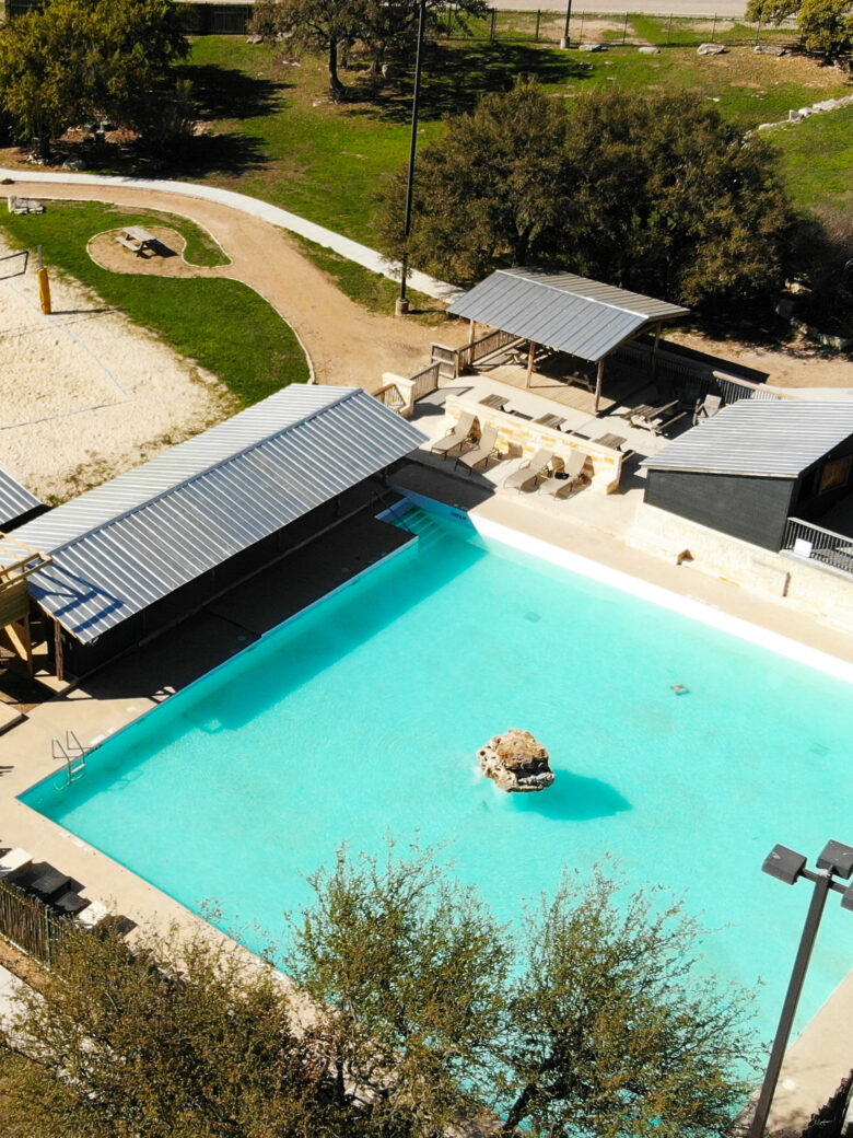 Canyon Lake View Resort pool area with lounge chairs and beautiful landscaping