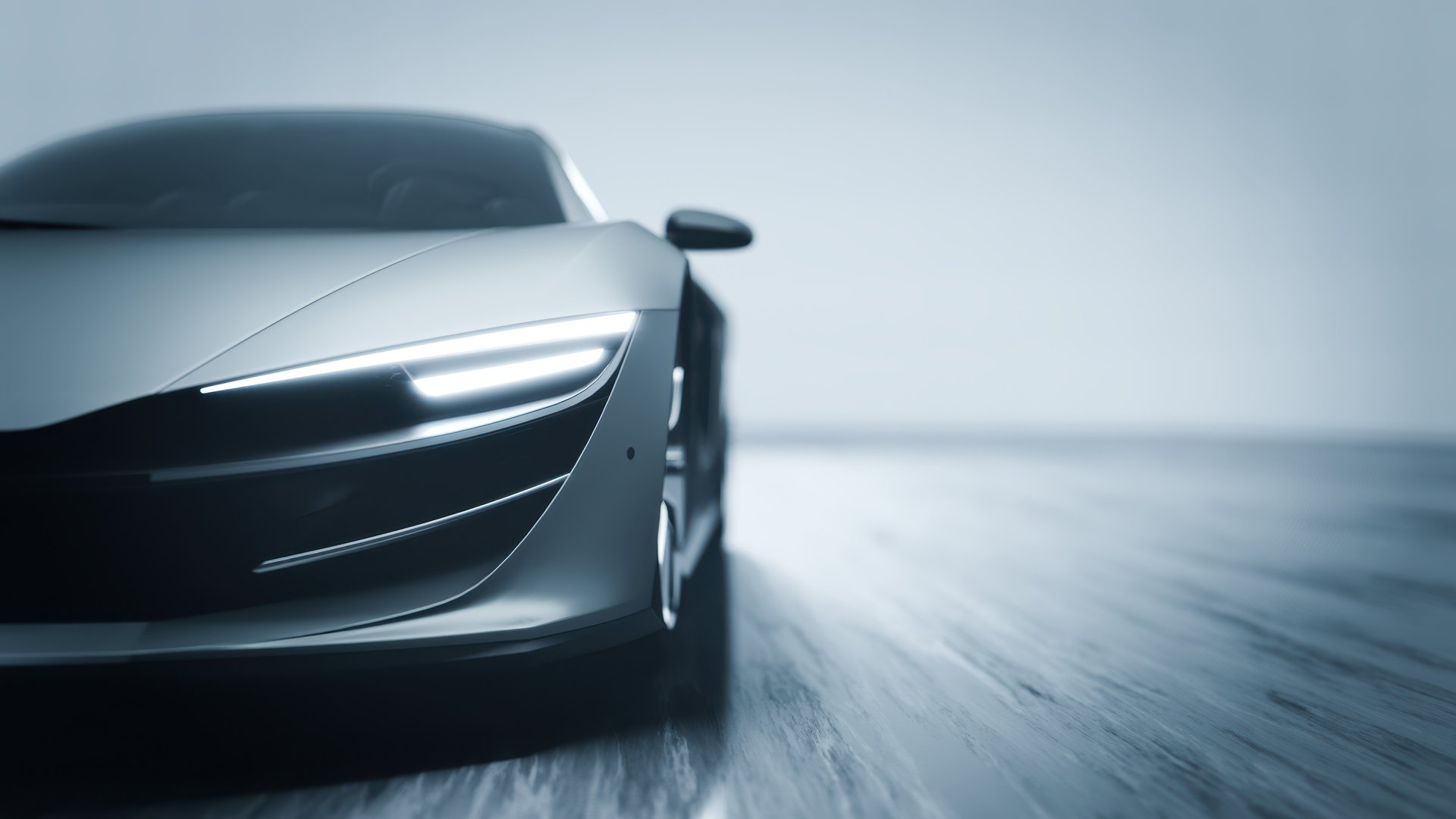 Silver sports car driving fast on a wooden floor in a studio with lights on