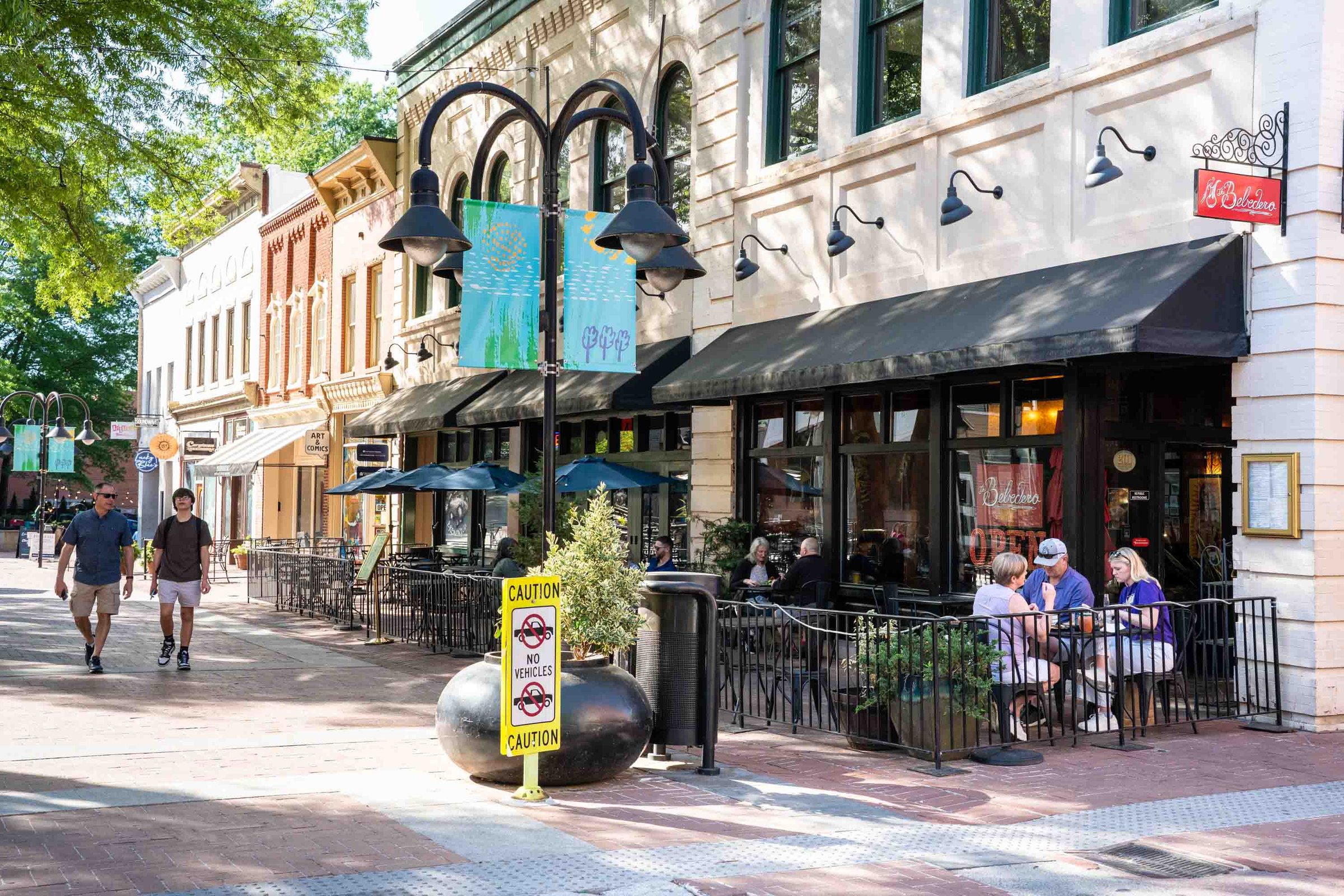 Charlottesville, Virginia- April 23, 2025: View of historic Downtown Mall in Charlottesville VA on a sunny day with people and historic architecture in view.