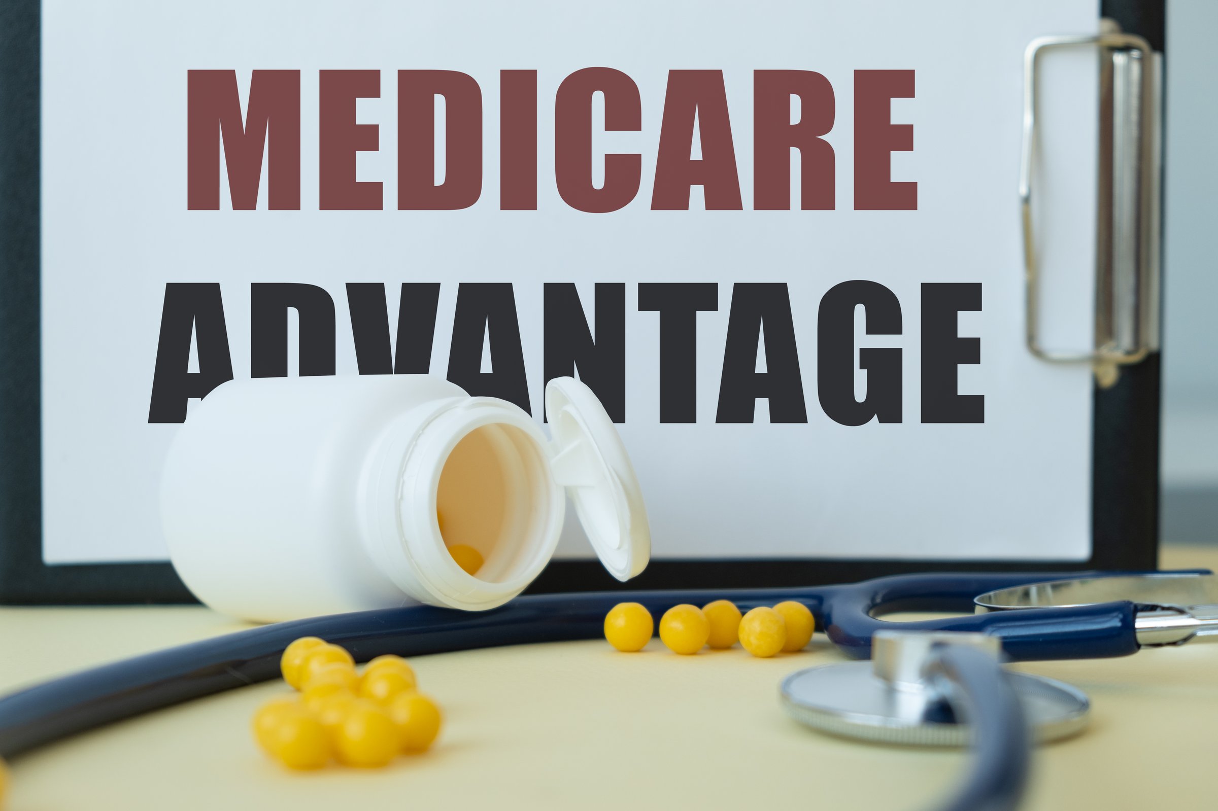 Medical and health concept. Phrase MEDICARE ADVANTAGE written on the business card in a composition with a stethoscope
