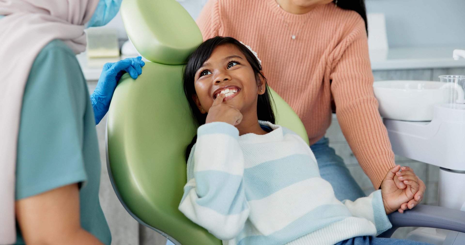 Kid, dentist and appointment for teeth or oral health education for prevention on tooth decay or hygiene. Little girl, mom and together for dentistry checkup or dental examination with orthodontist.