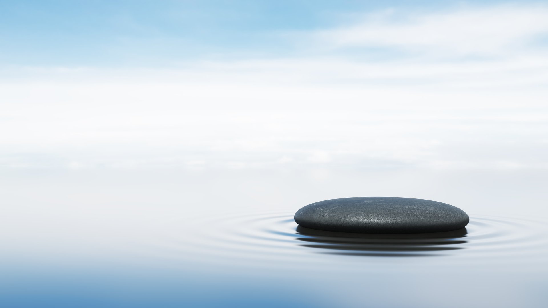 Black rock floating on the surface of the water pedestal. blue sky ocean cool open sea zen concept liquid ripple waves stand product display skincare cosmetics luxury perfume scent. 3D Illustration.