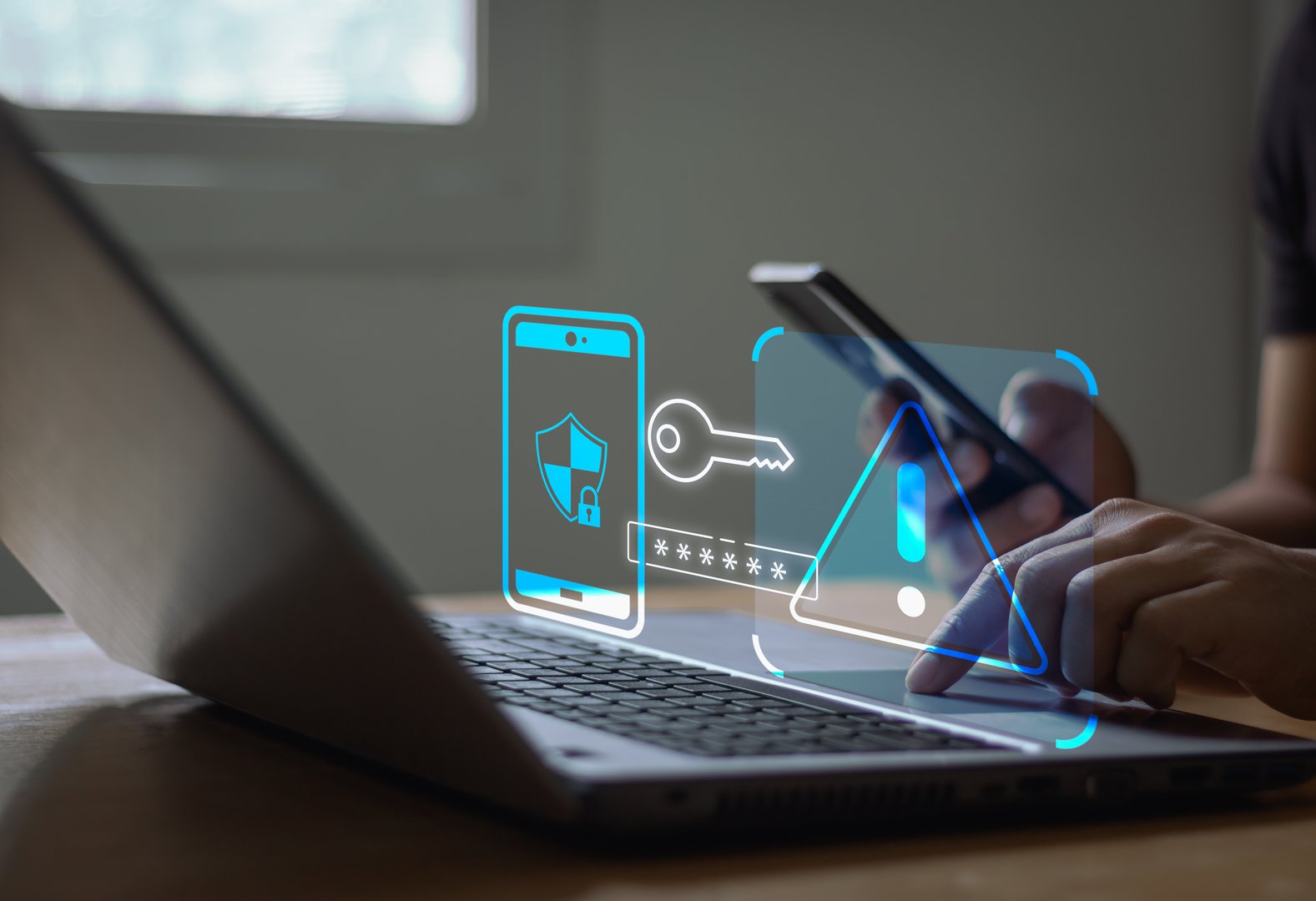 Cyber crime and cyber security alert warning concept. Hand using laptop and smartphone with 2 step verification for identity identification, multi factor authentication, information secure encryption.