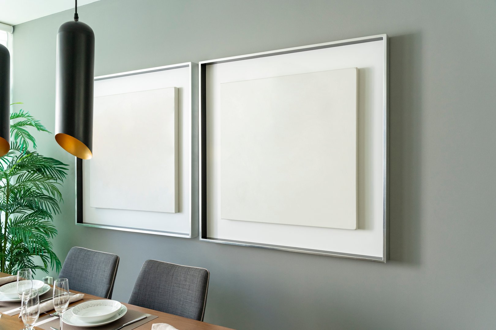 Modern house decoration, empty silver square frame, poster, white canvas, mock up, on a gray wall, dining room, painting gallery template angle view