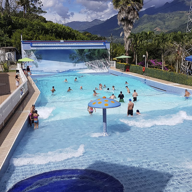 Tropical pool with water slides at resort