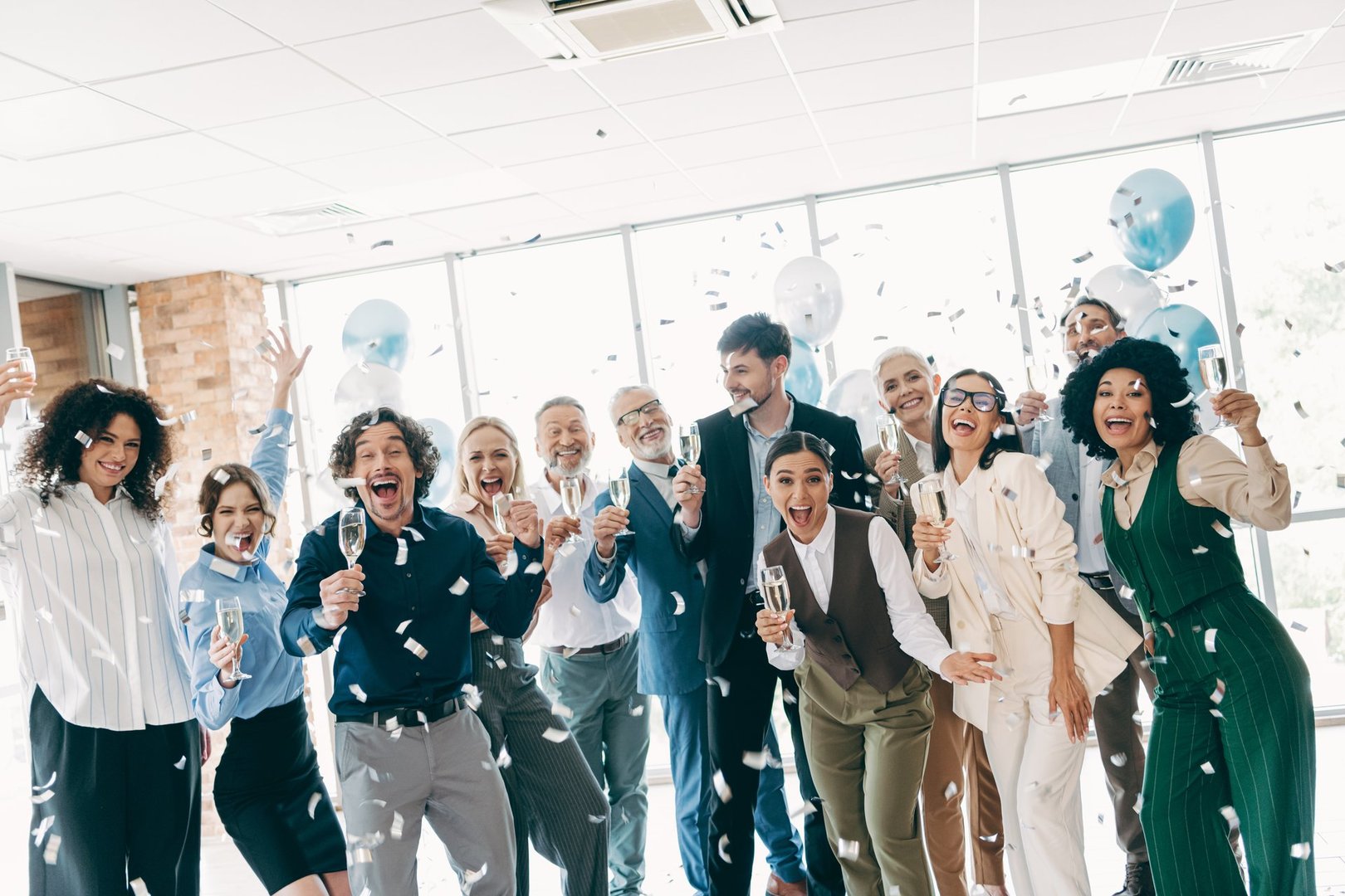 Group of professionals celebrating success with champagne
