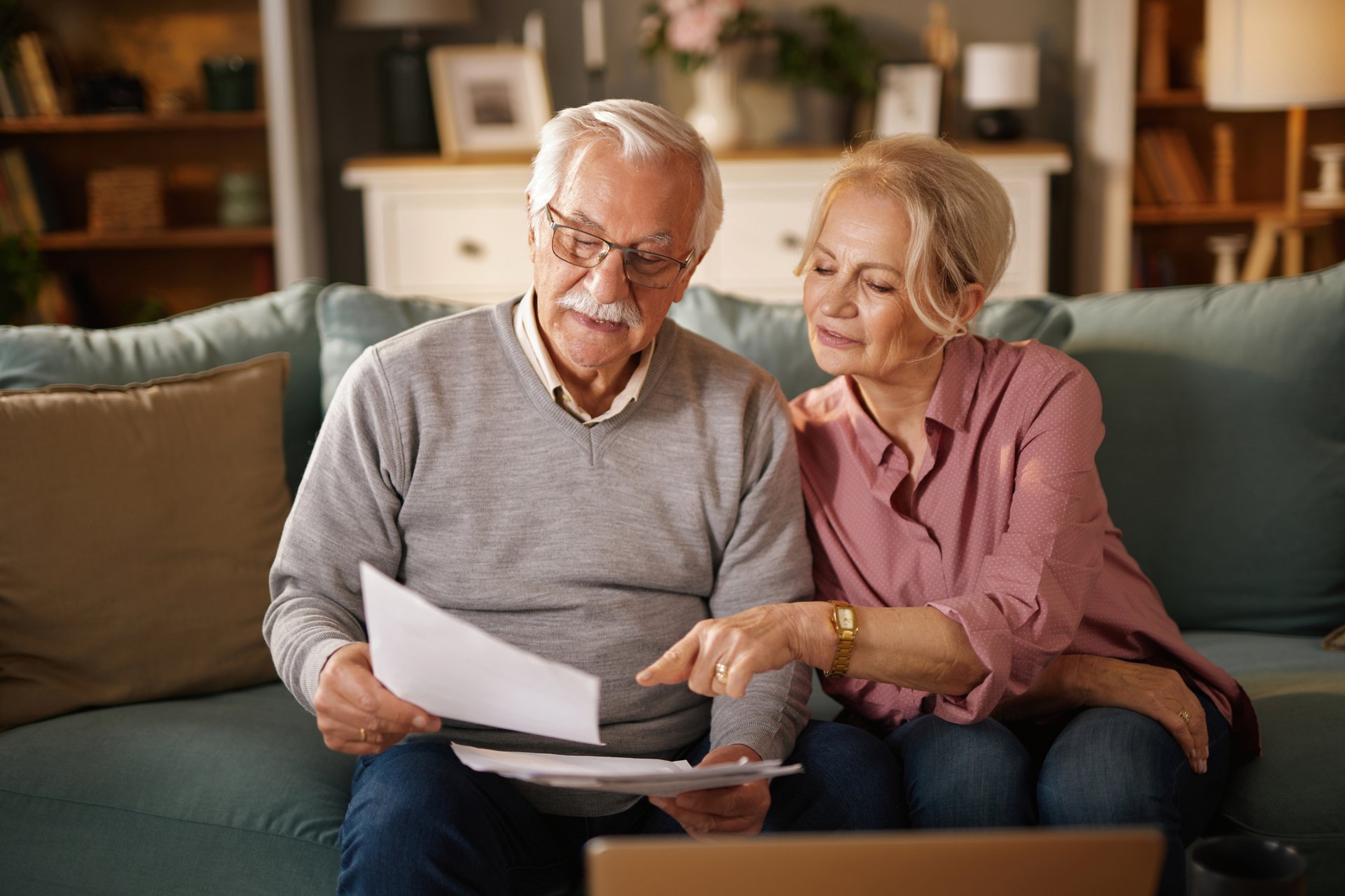 Elderly couple reviewing life insurance policy documents