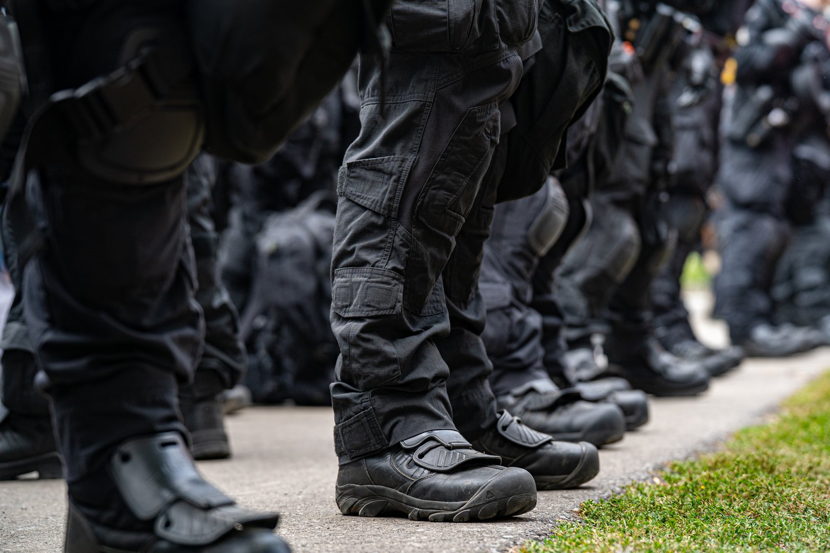 Close up of police boots in line during rally.