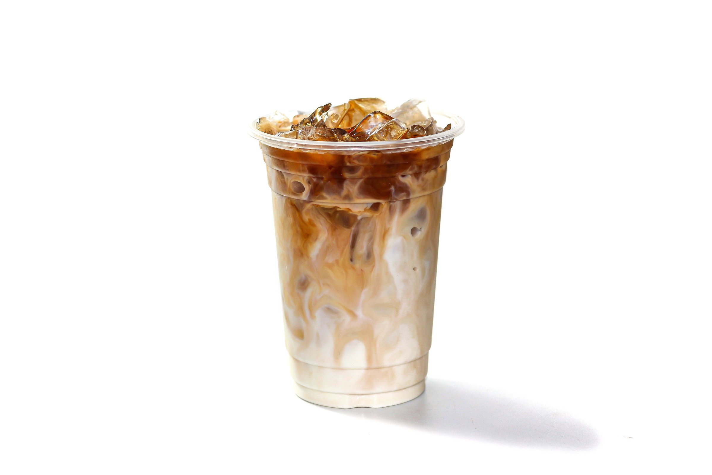 Latte ice coffee put on white background with isolated photo style serving with milk topping.
