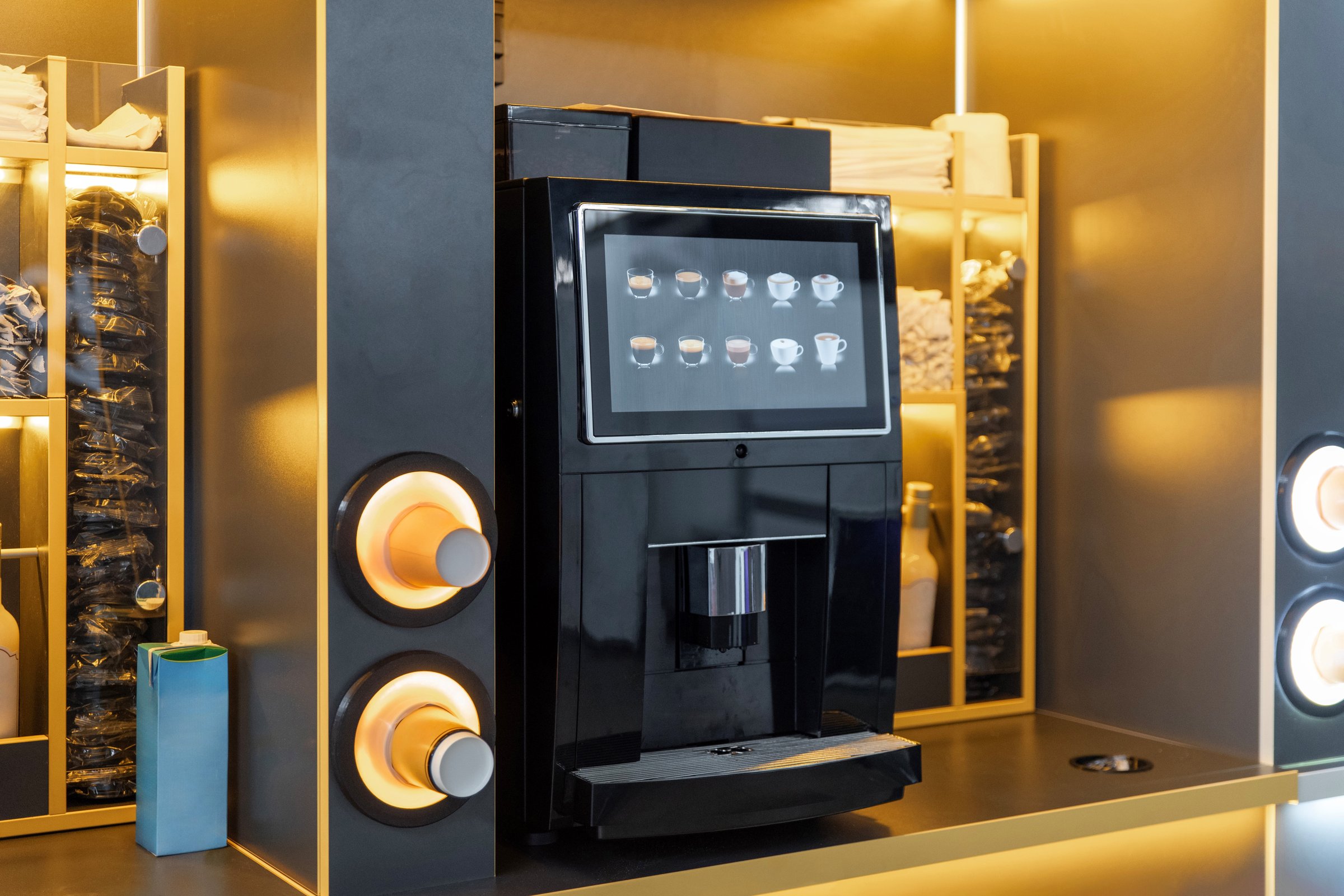 Self-service coffee machine with touch screen in a modern vending area