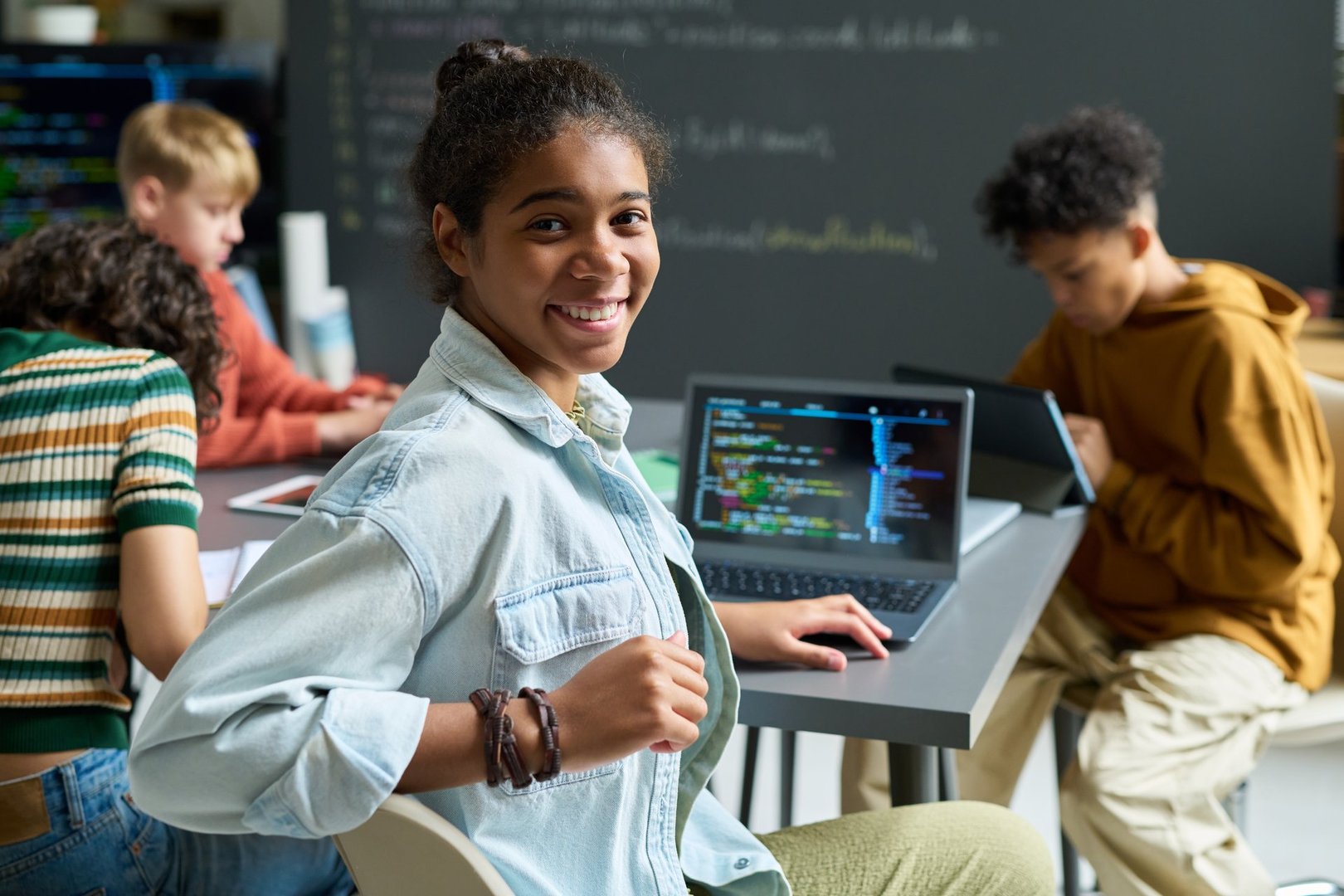 Teen student studying with laptop happy learning