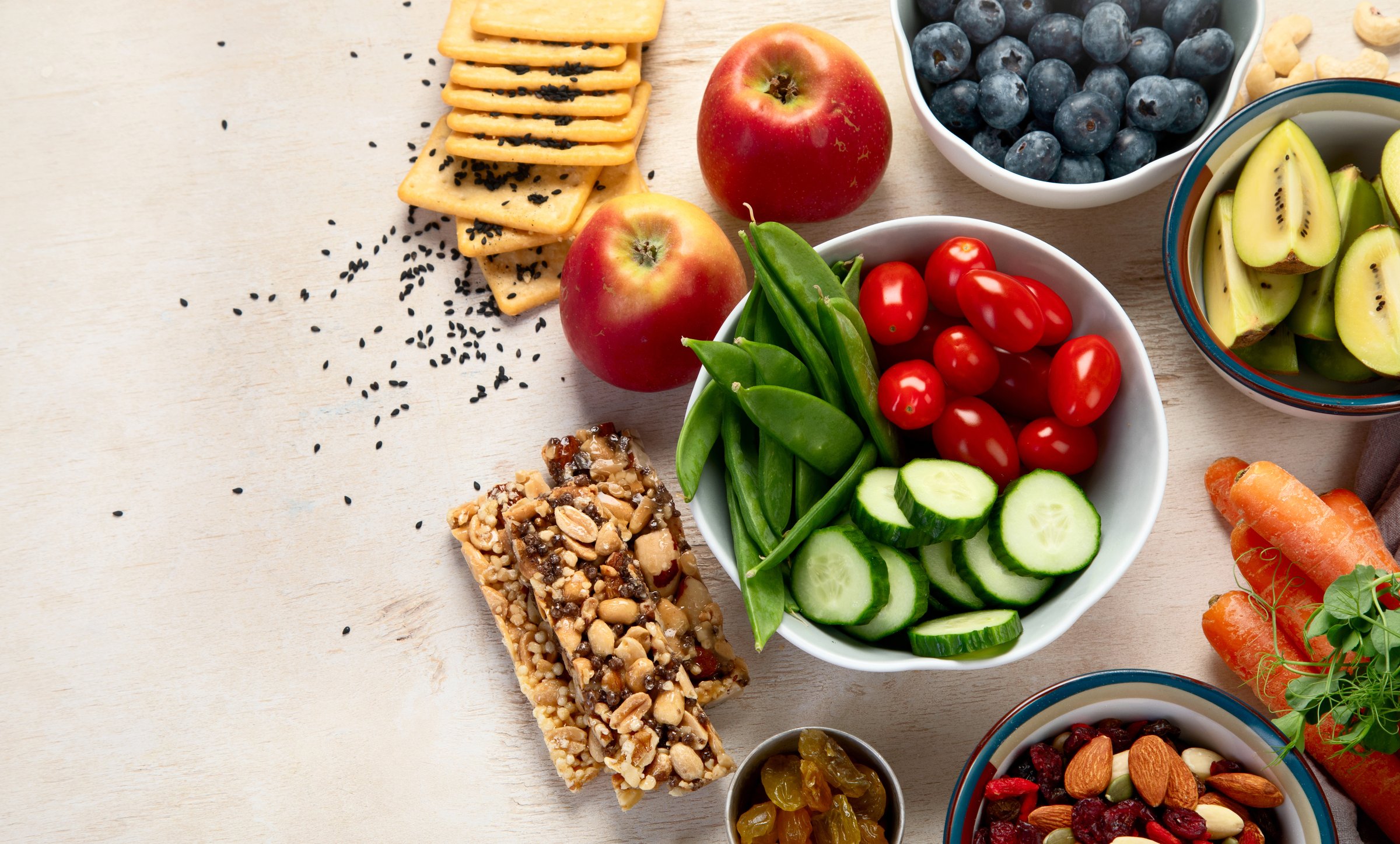 Healthy balanced dieting concept. Selection of rich fiber sources vegan food. Vegetables, fruits, seeds and nuts. Top view.