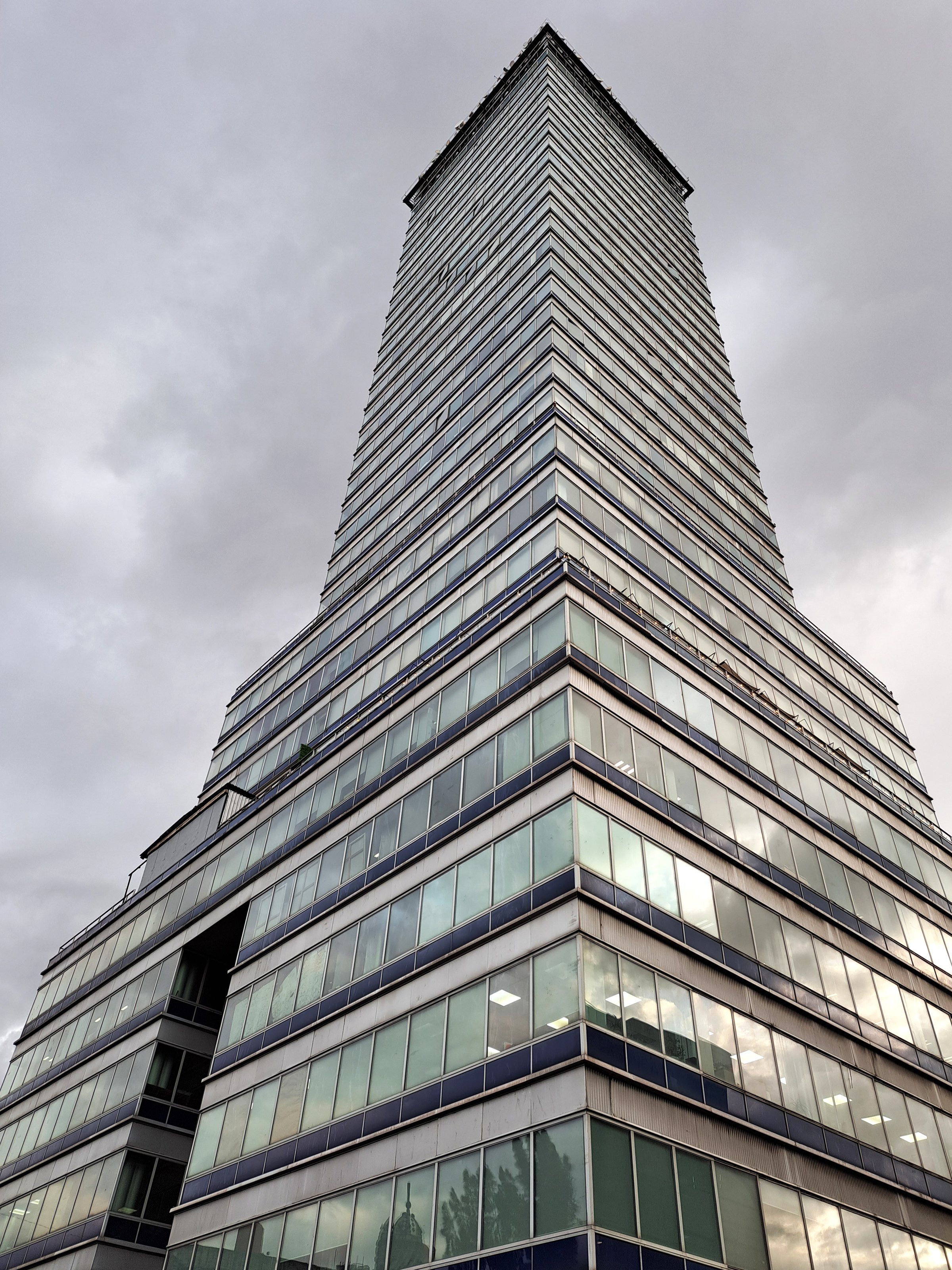 Mexico City, Mexico - Aug 23 2023: The Torre Latinoamericana is a skyscraper and emblematic building in the Historic Center of CDMX