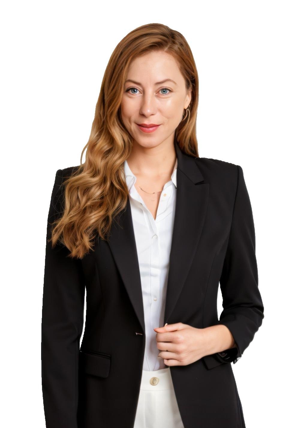 Woman in a black blazer with long wavy hair, posing against a white background, holding the front of her jacket.