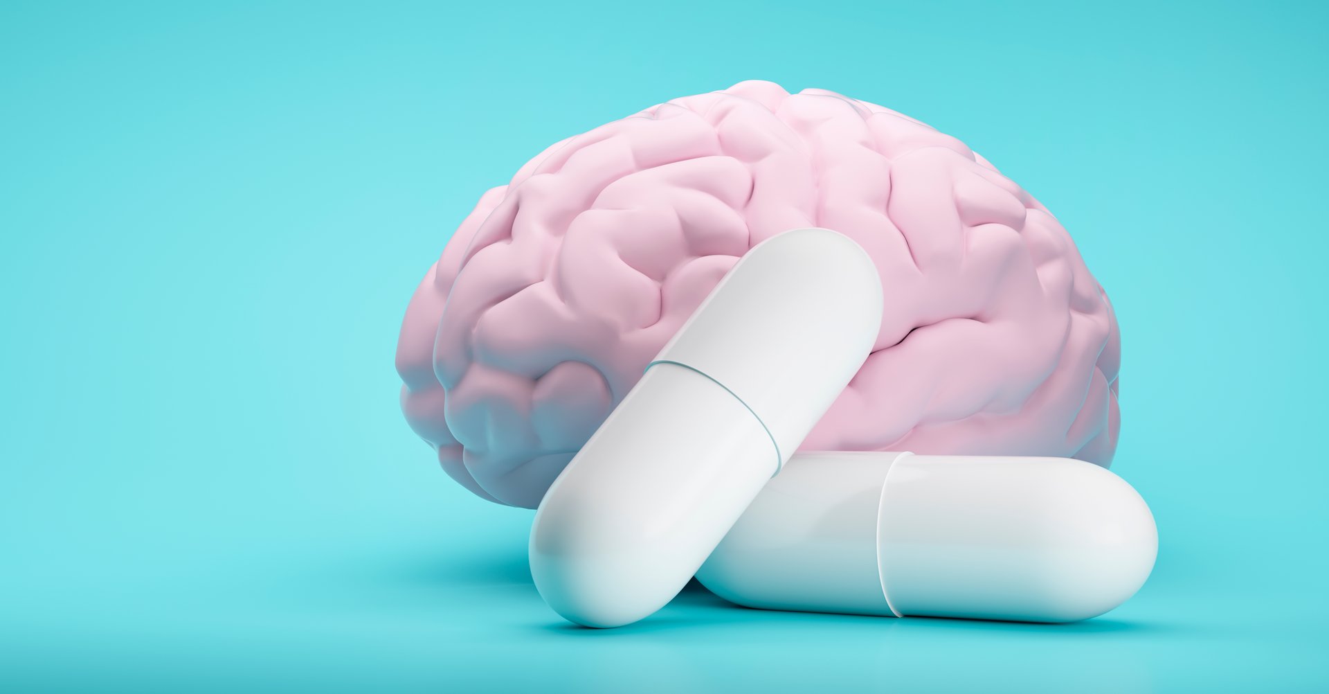 White Pills on blue background with brain model