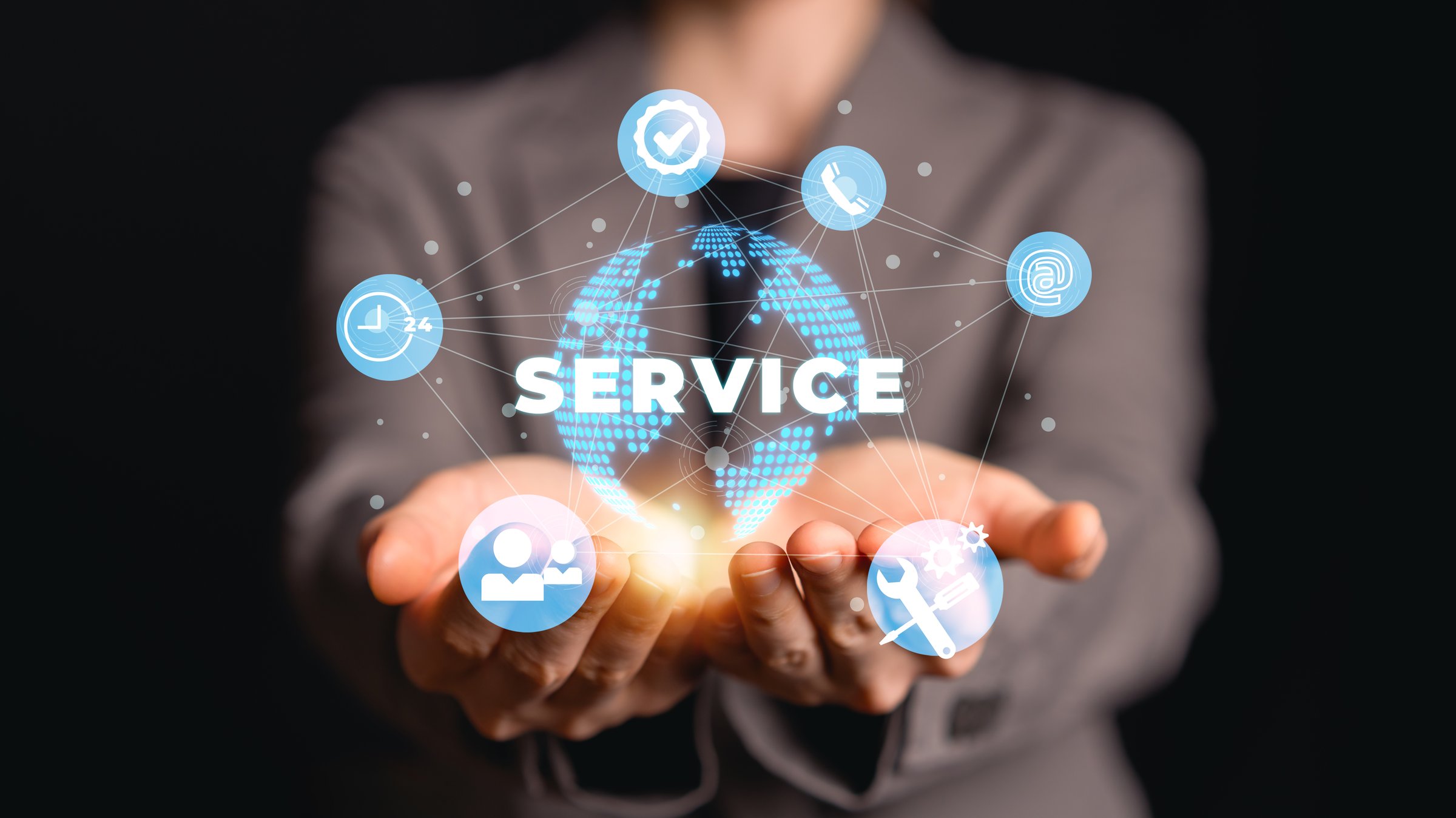 Businesswoman holding virtual global service network icons with customer support tools communication. Customer service and support solution, and 24 hour assistance concept