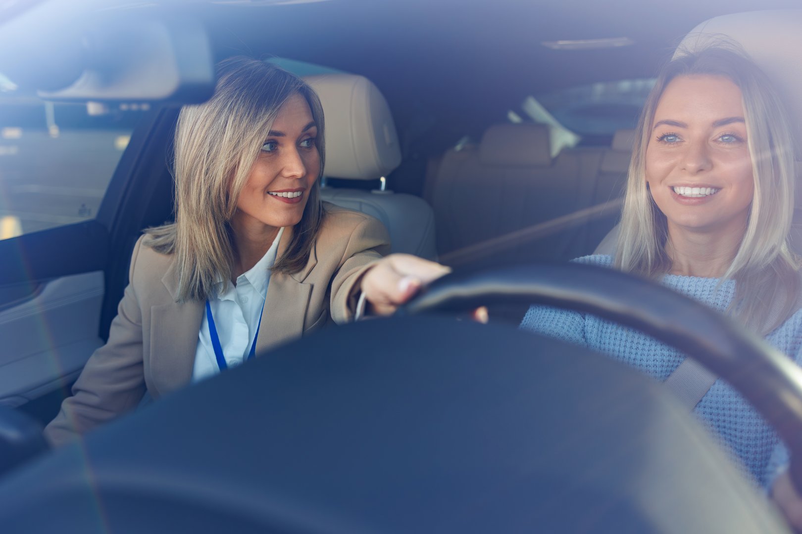 Friendly Driving Instructor Encouraging Student During Lesson