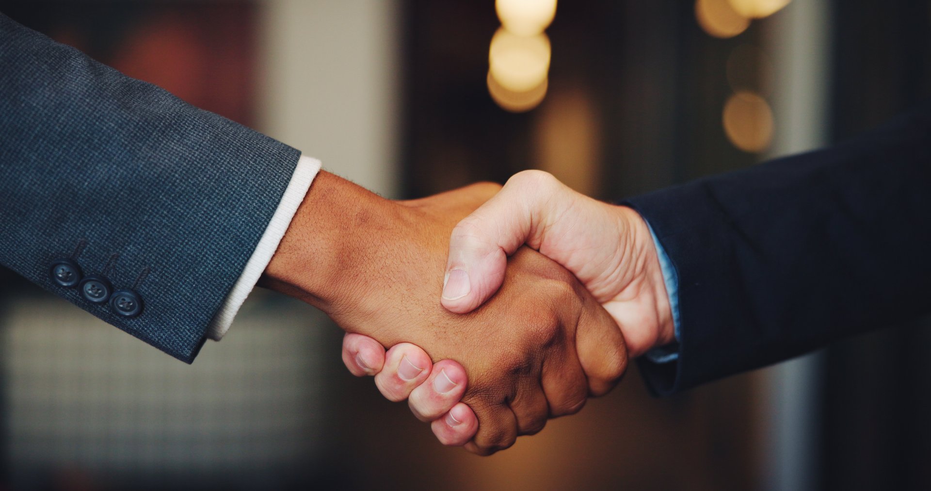 Business people, corporate deal or handshake in merger agreement for greeting, meeting or partnership. Collaboration, night and entrepreneur with manager for B2B support, introduction and recruitment