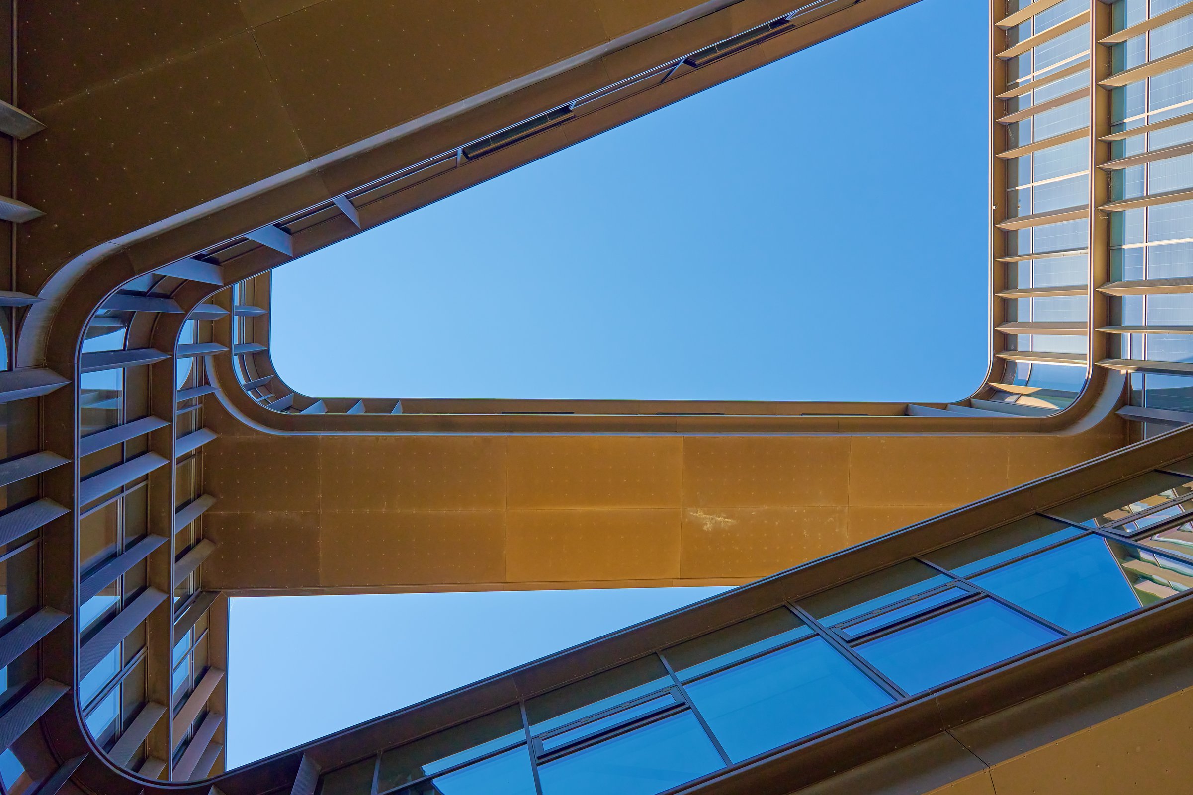 Geometric composition with architectural elements. Exterior of modern building against blue sky. Minimalistic street architecture in Copenhagen, Denmark