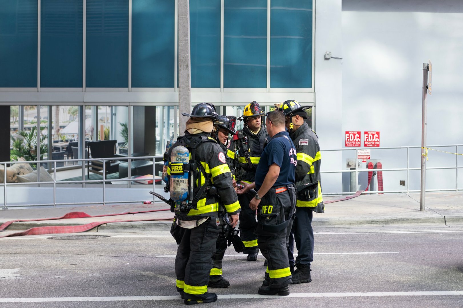 Miami, Florida, USA - December 01, 2024: Fireman of Miami. 911 emergency. Firefighter in uniform. Team of fireman. Firefighter teamwork in fire suit on rescue duty. Fire rescue response.