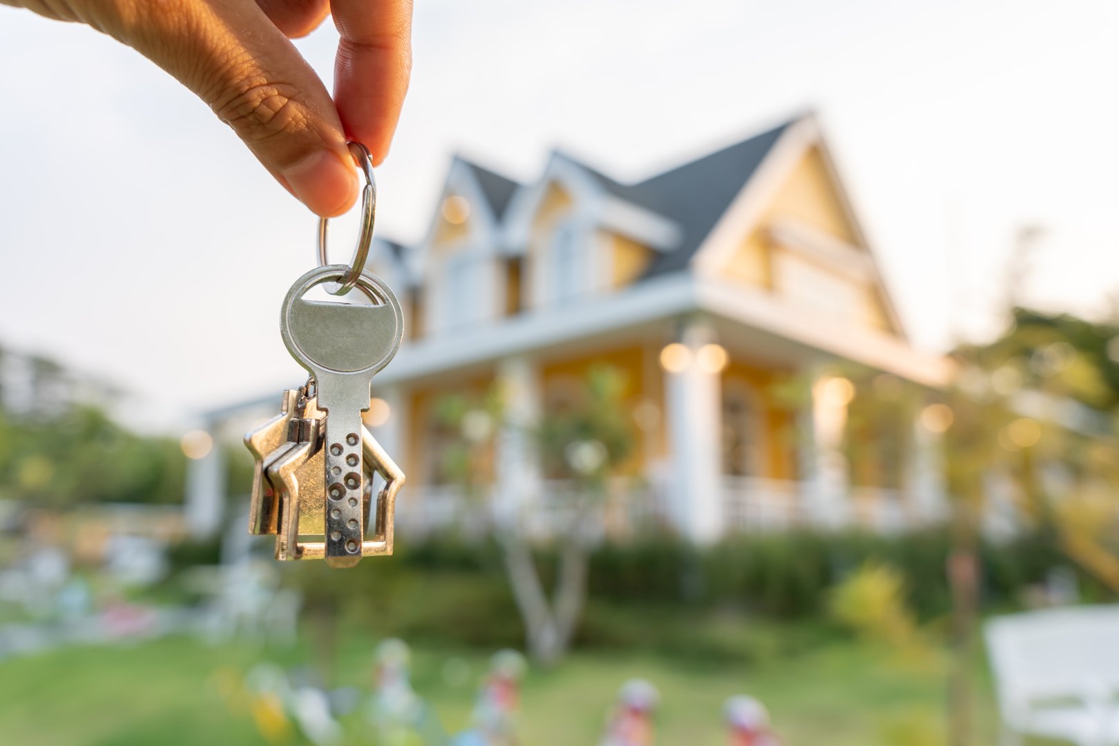 Real estate agent holding keys for new home
