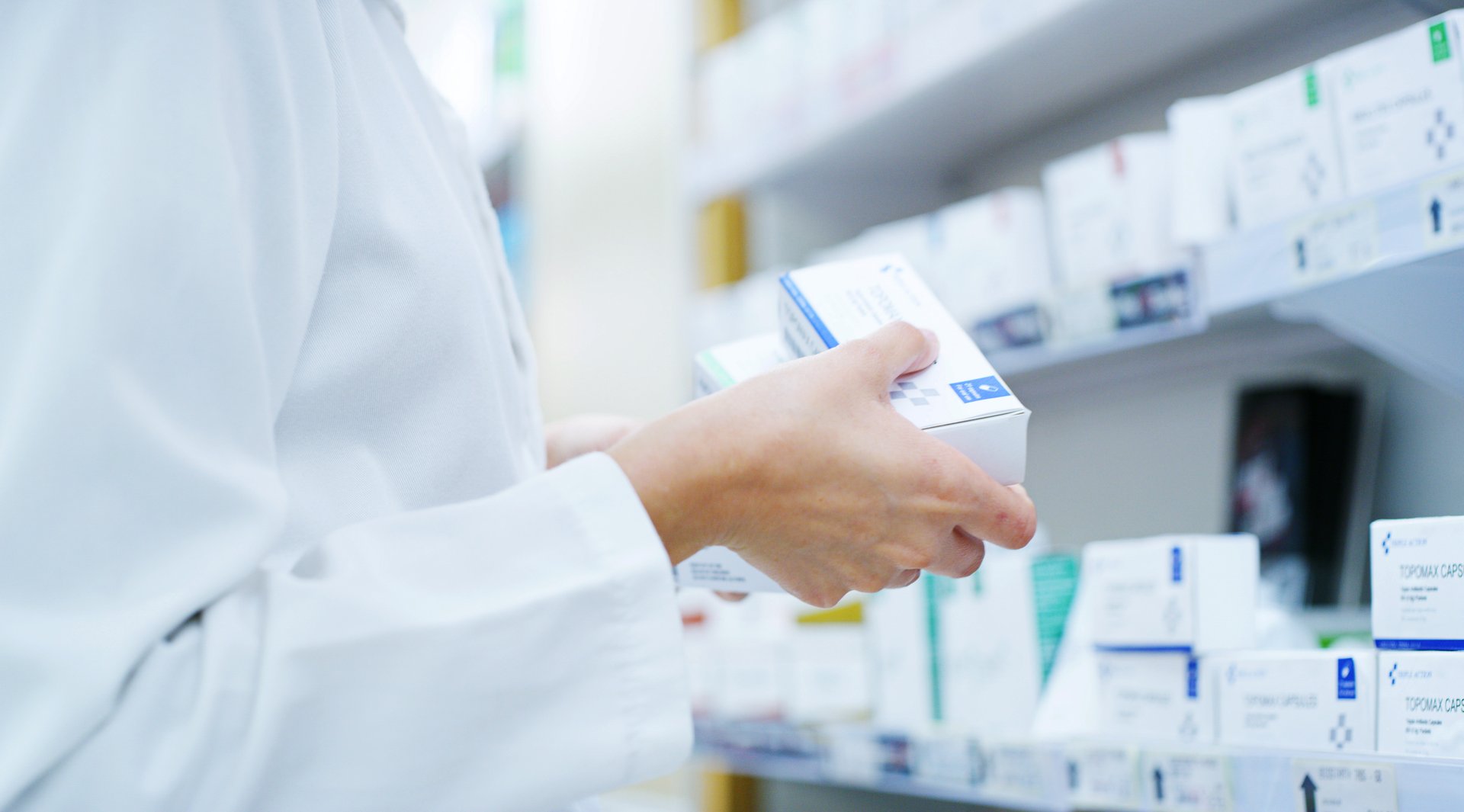 Pharmacist carefully dispensing medication