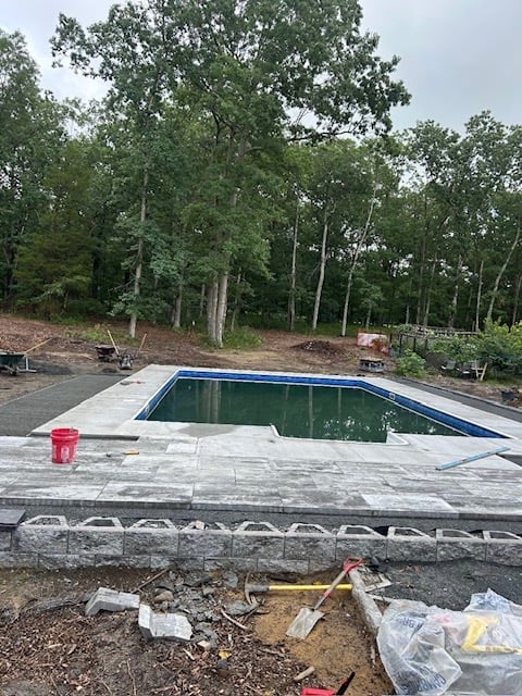Pool paver installation work in progress