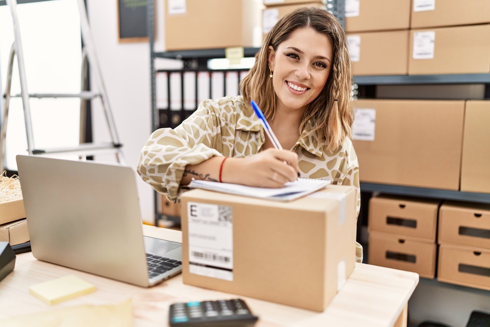 Young hispanic woman smiling confident working at office