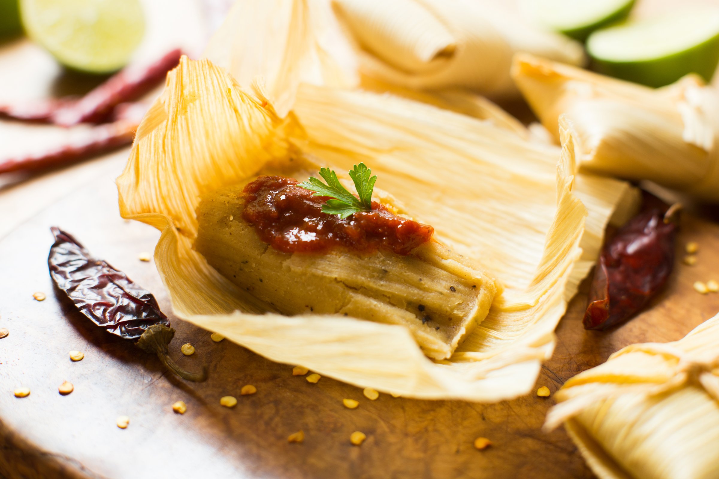 A tamale, in Spanish tamal, is a traditional Mesoamerican dish made of masa, a dough made from nixtamalized corn, which is steamed in a banana or corn leaf.