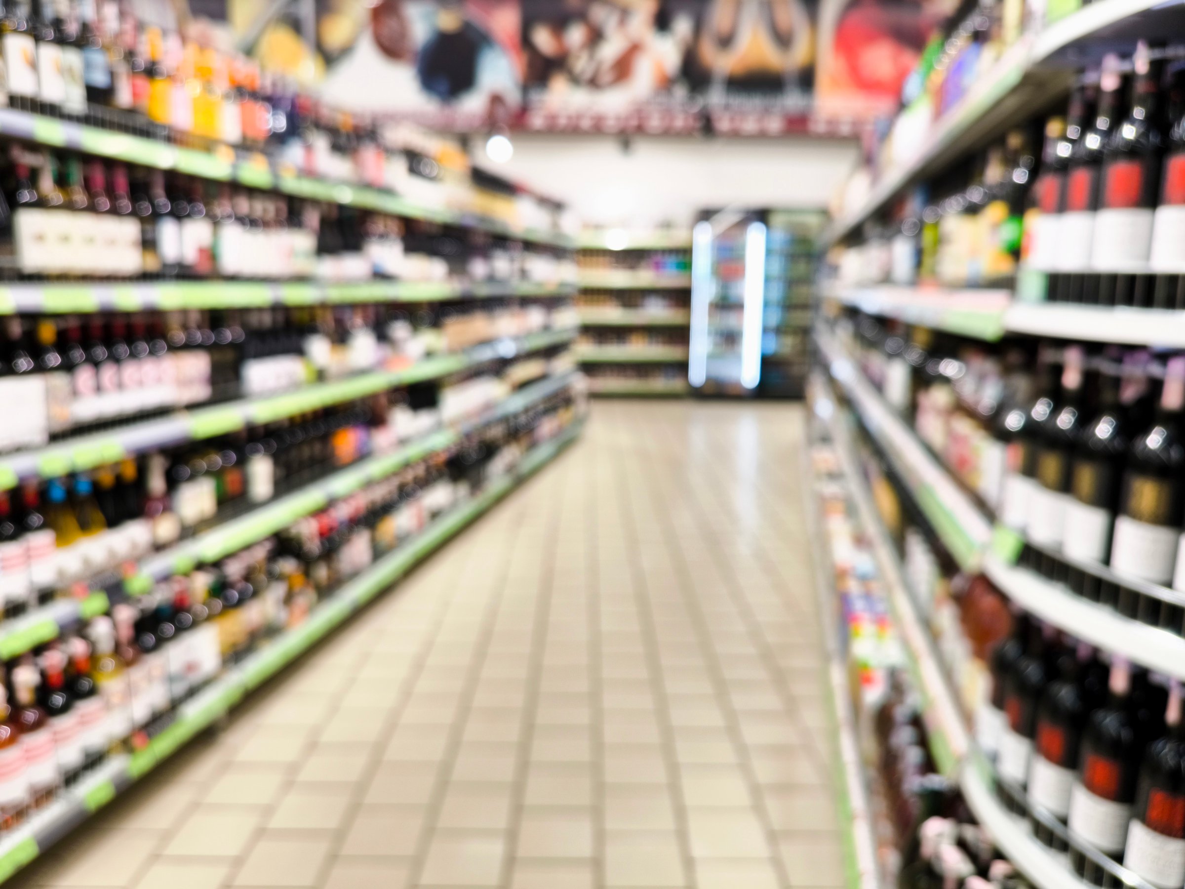 Abstract blurred background of a supermarket counter. blurred supermarket background. alcoholic beverages, alcohol showcase