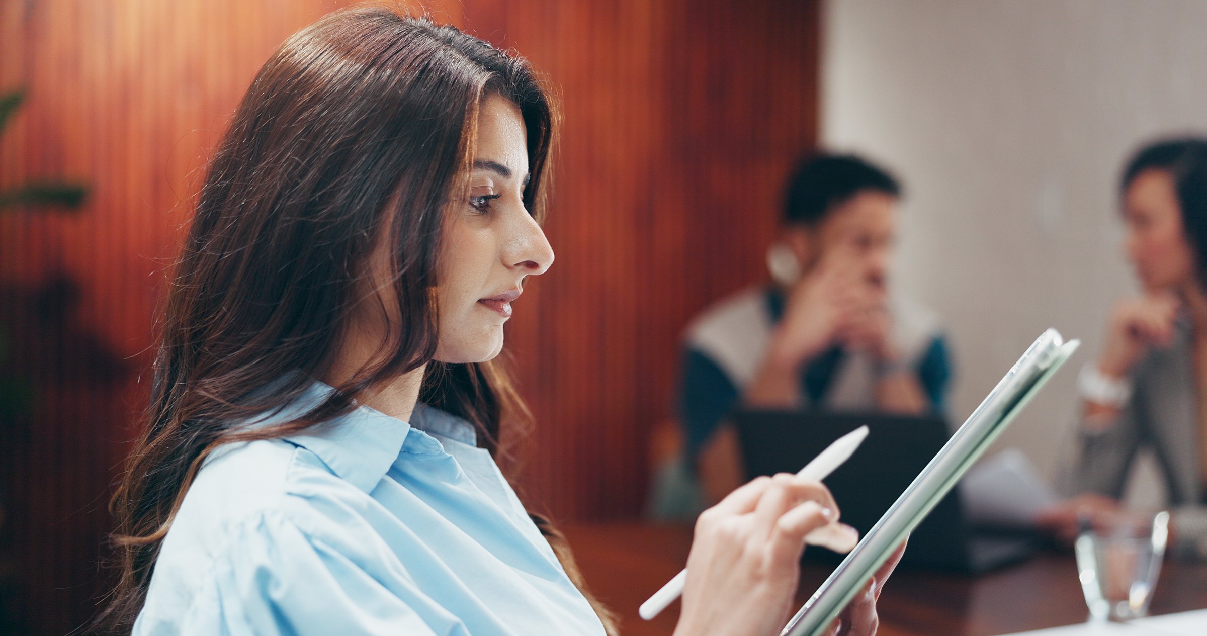 Business woman with tablet planning event