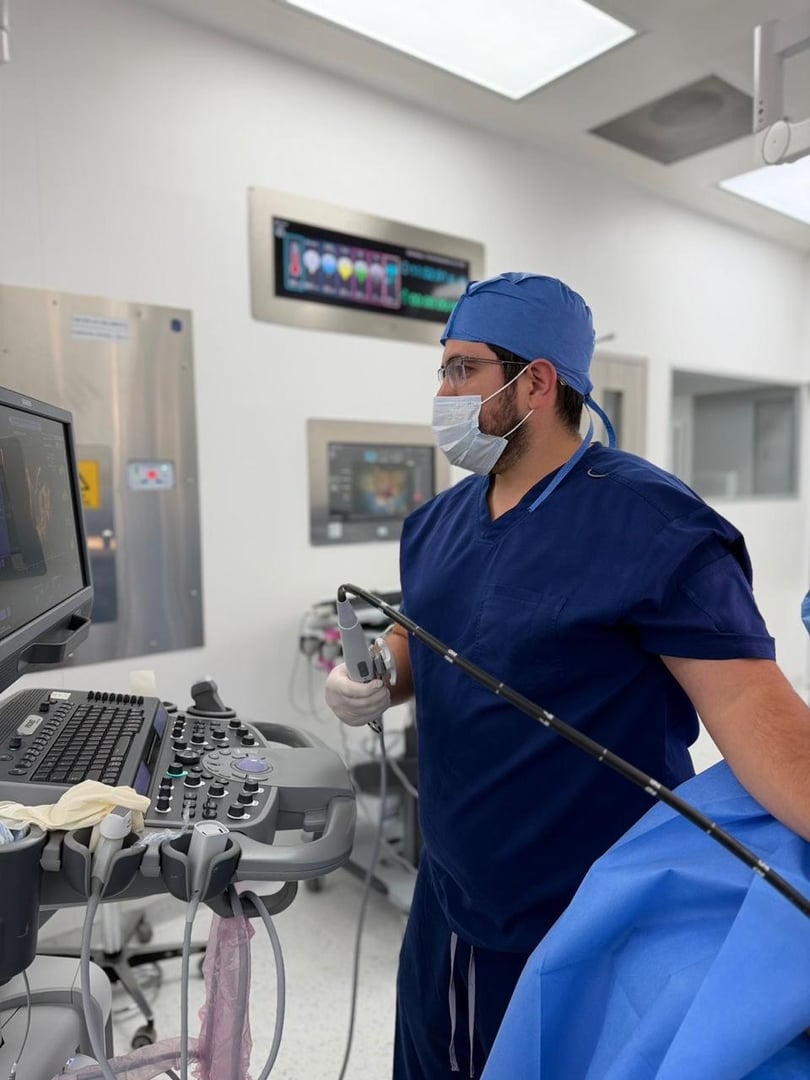 Young adult female doctor is taking the blood pressure of a female patient during a medical consultation