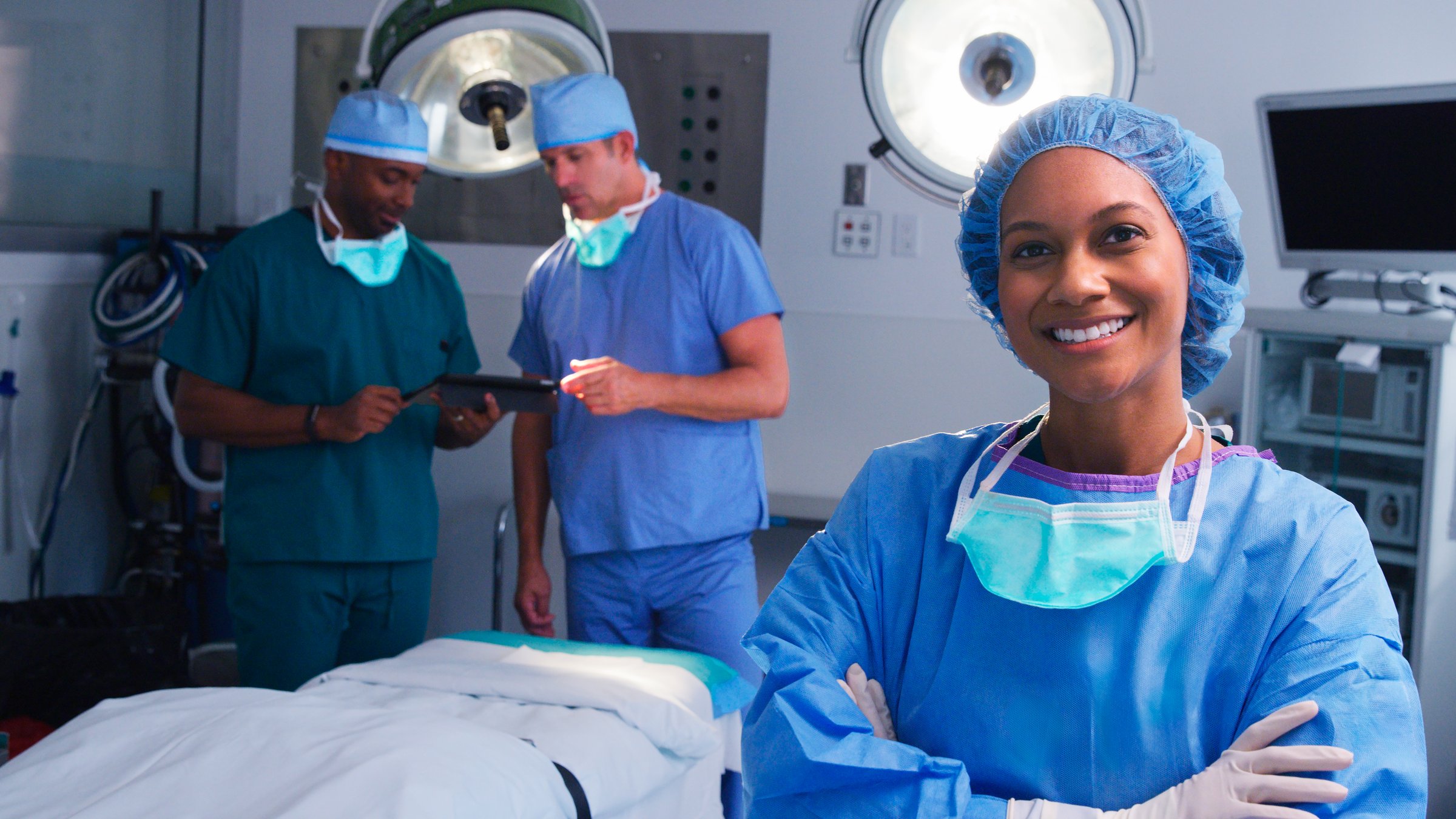 Portrait Of Female Surgeon Wearing Scrubs In Hospital Operating Theater