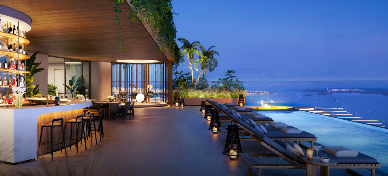 Rooftop bar with a pool, modern seating, and city views at dusk. Ambient lighting and tropical plants enhance the atmosphere.