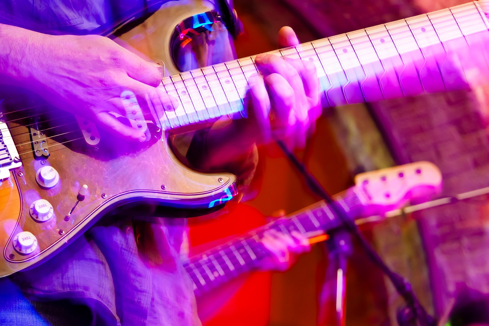 Two  guitars during a rock concert.
