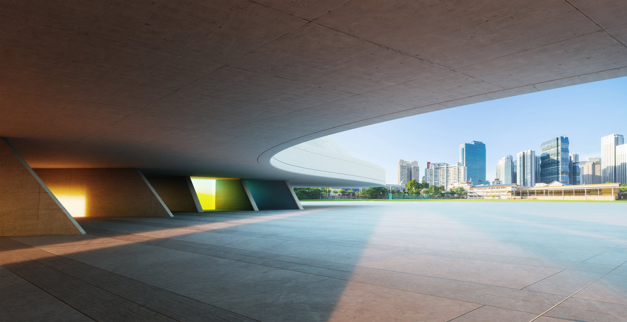 Empty concrete ground with colorful wall under modern architecture and cityscape background. 3d rendering