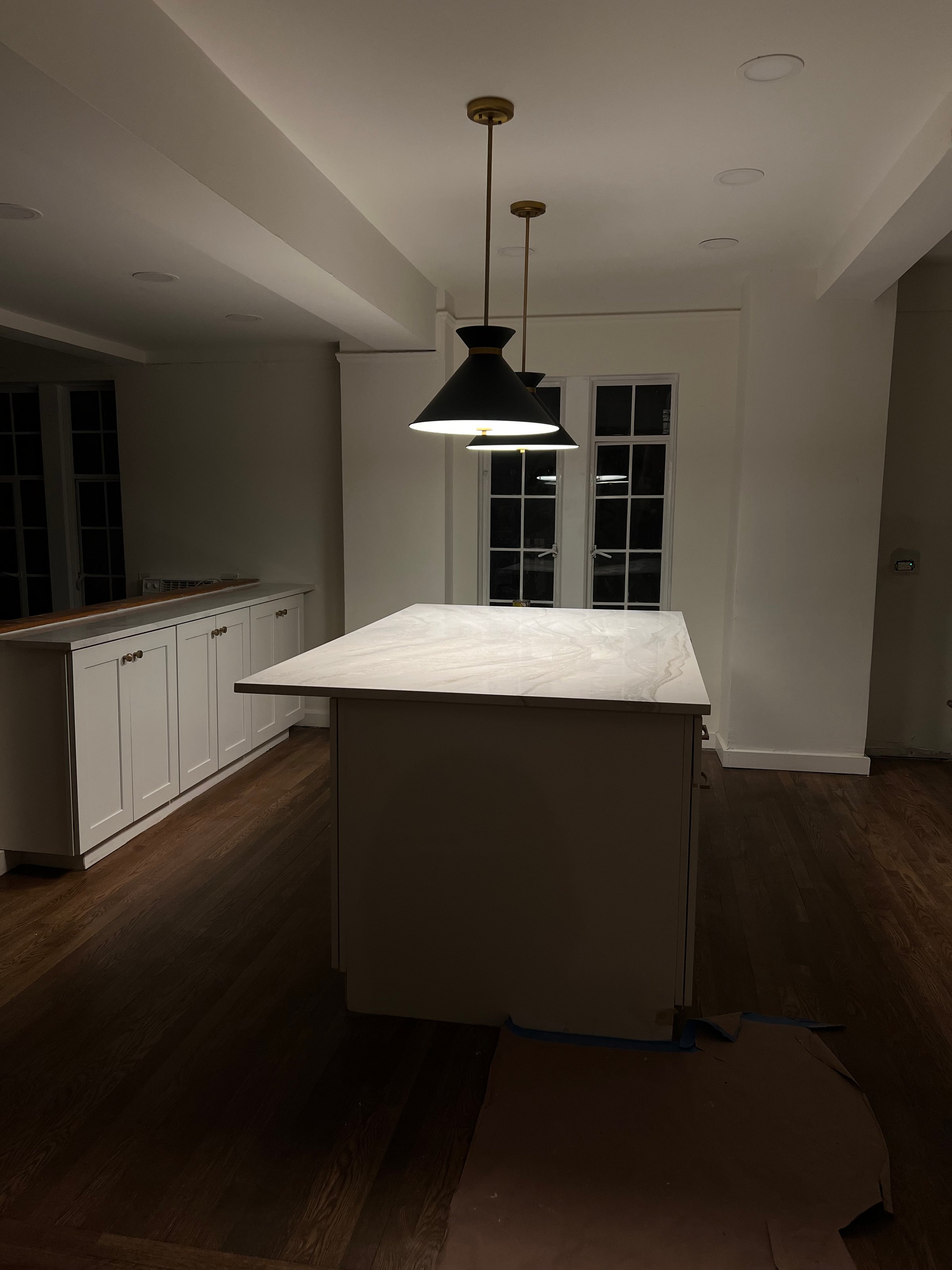 A cozy living room with an orange sofa, plants, and elegant decor. 3d render