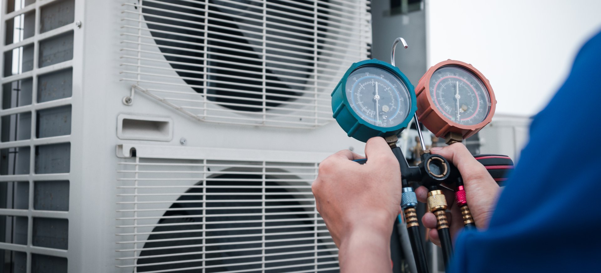 Technician is checking air conditioner,measuring equipment for filling air conditioners.