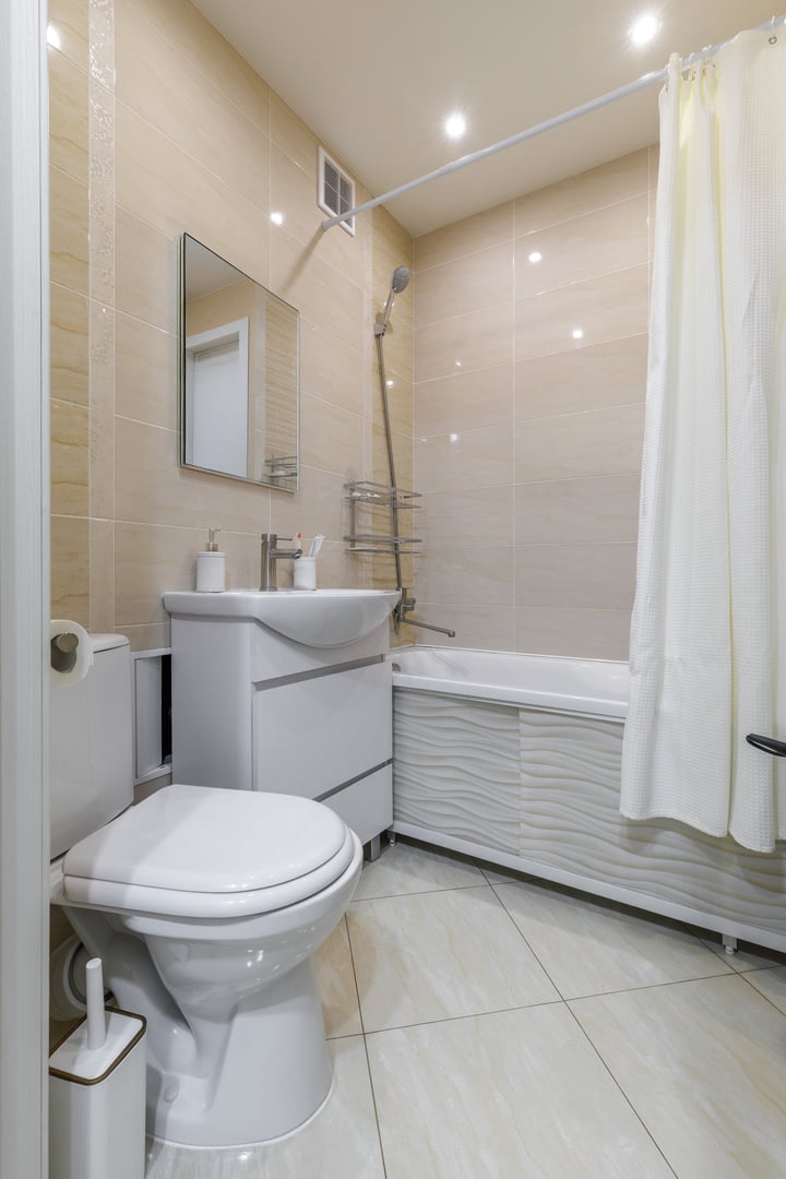 Contemporary beige tiled bathroom