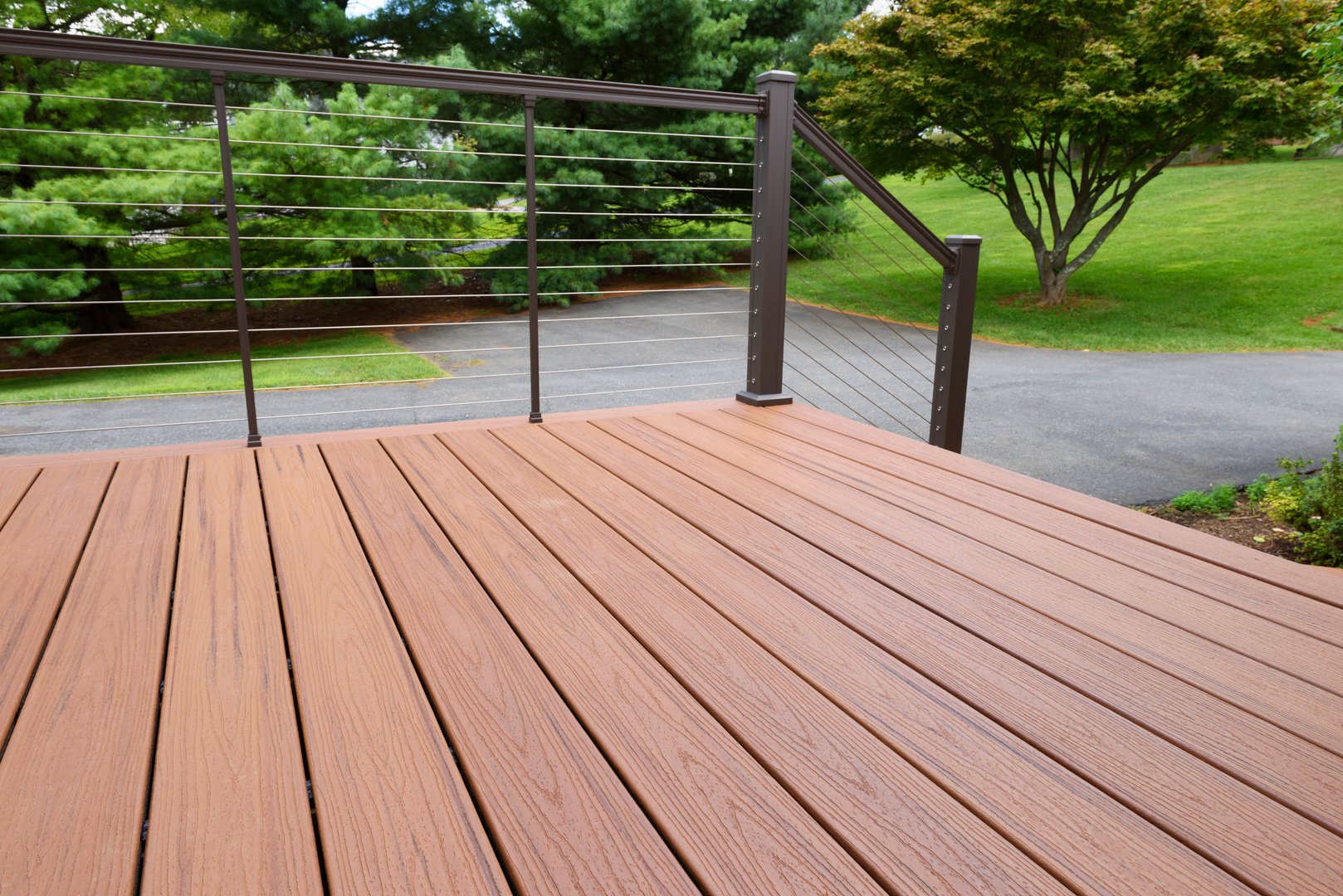 View of beautiful new deck with modern metal railing.