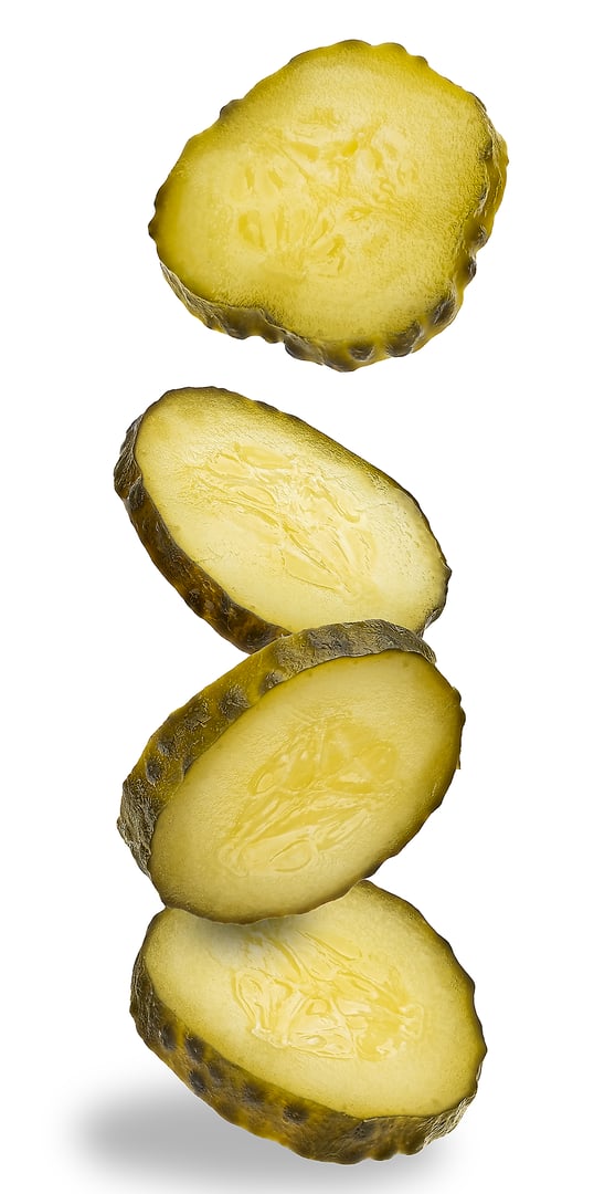 Pickle Slices Stacked on White Background