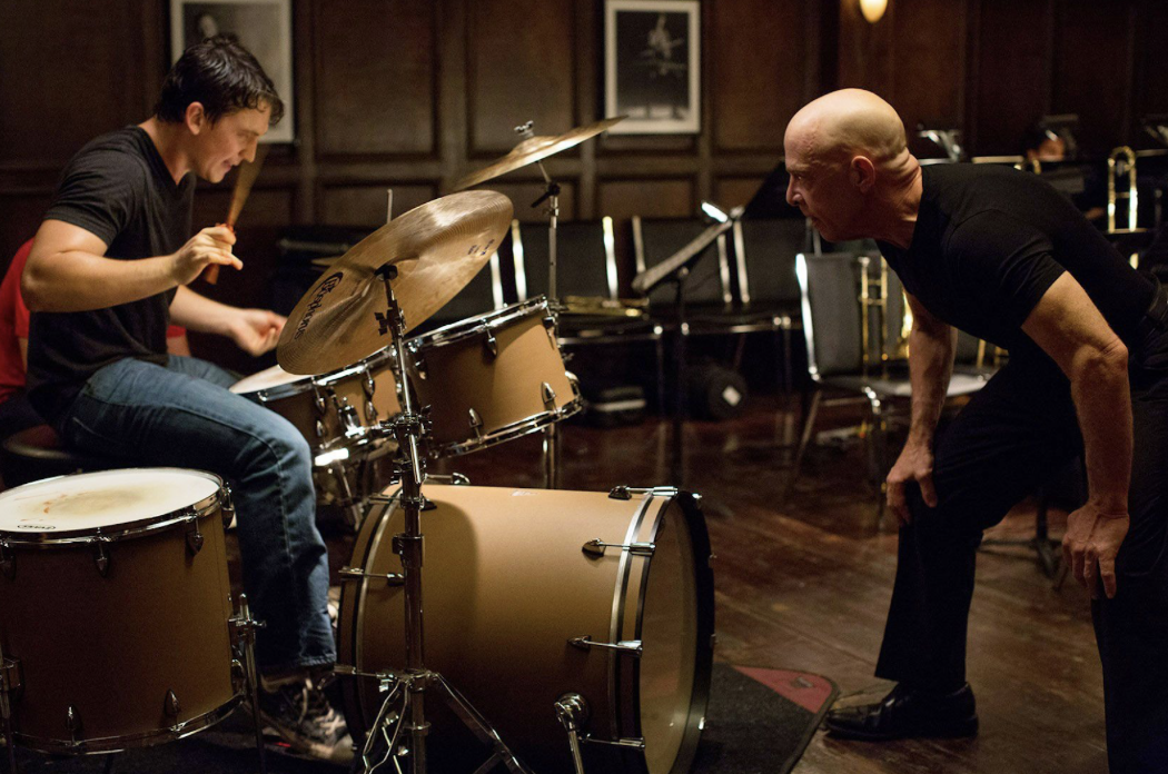 Whiplash film still image showing drummer and conductor confrontation