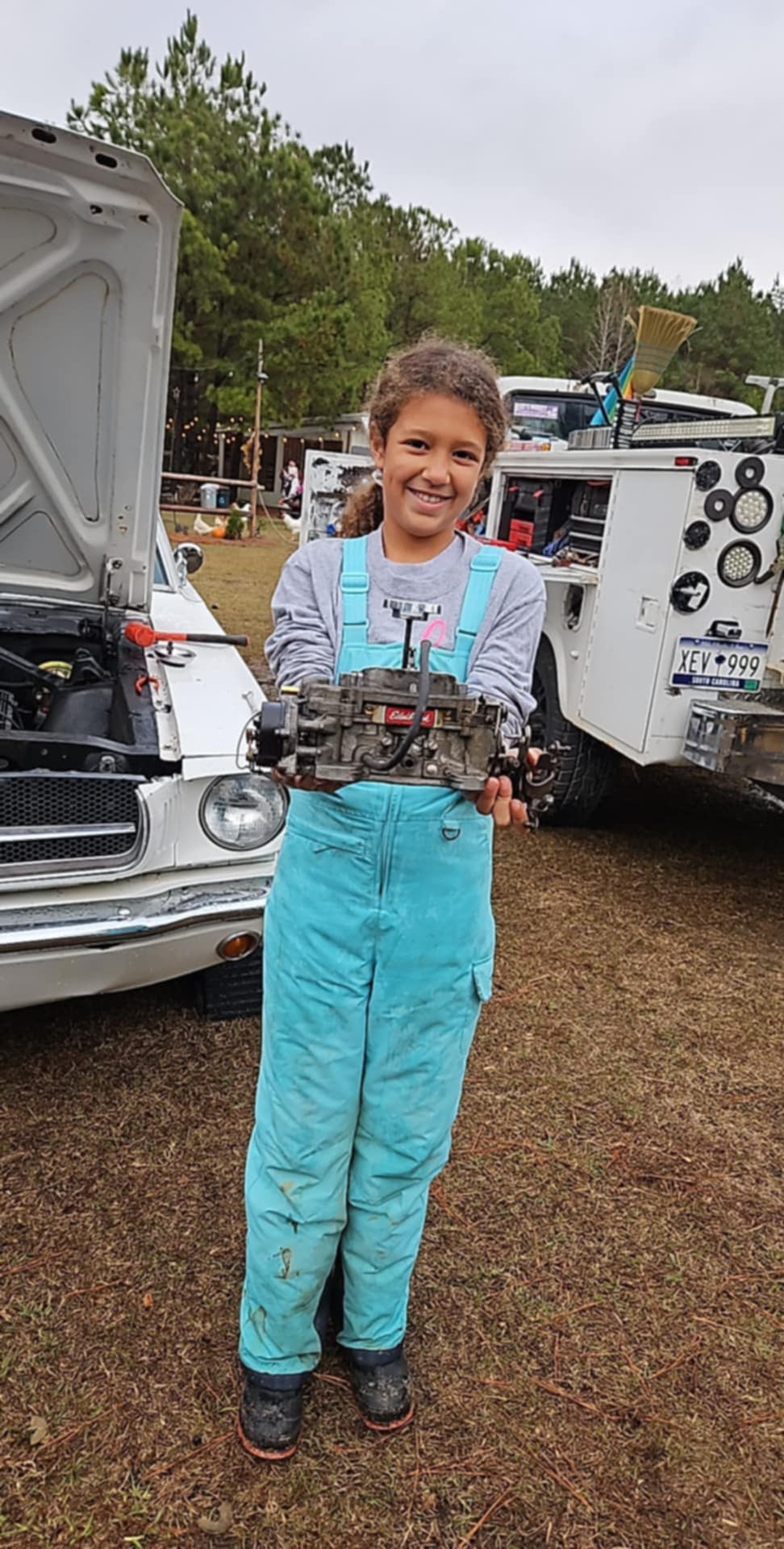 Students working together on vehicle restoration in the Restoration Barn