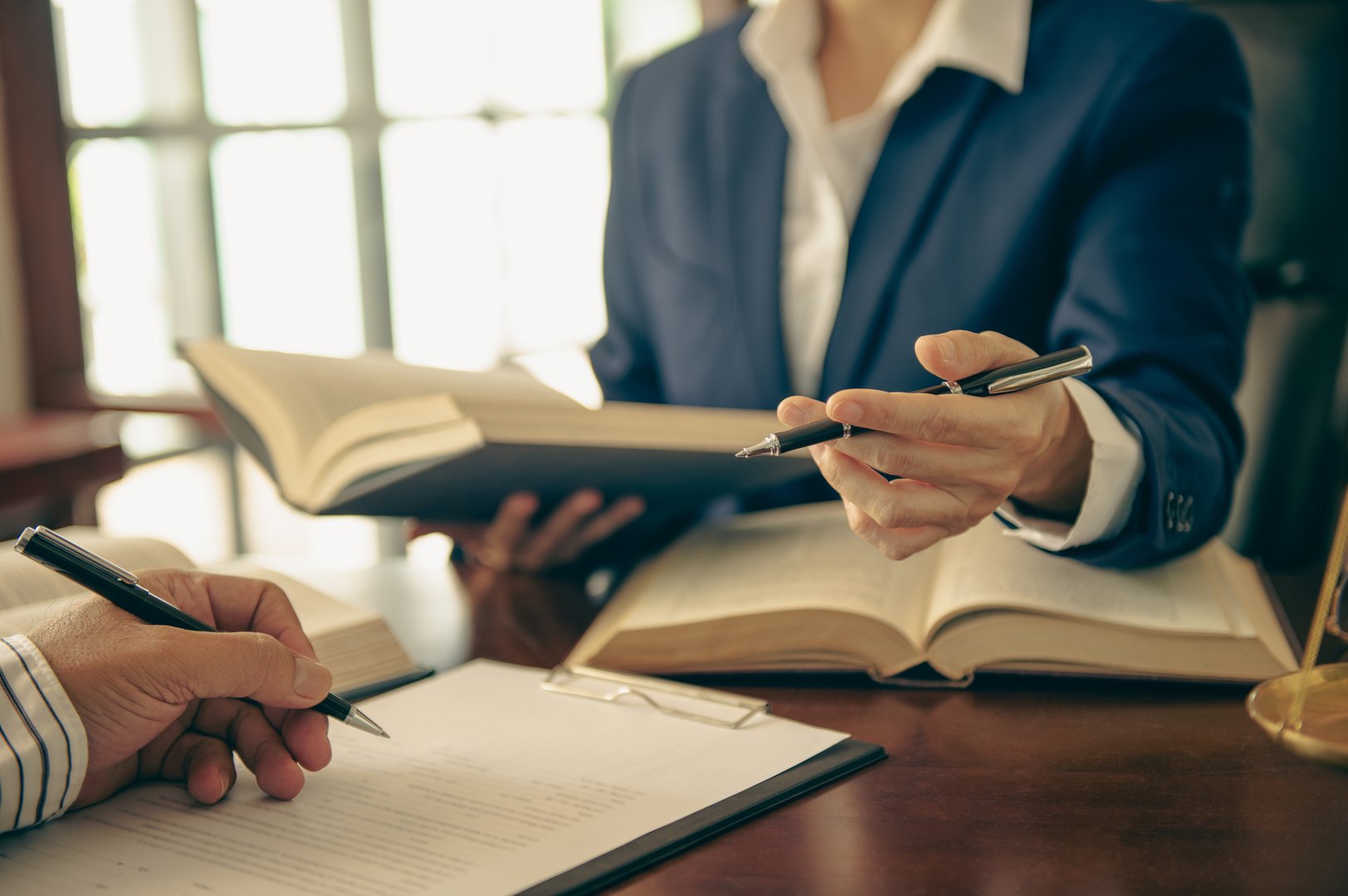 lawyers give advice about lawsuit agreements consultation of client and male lawyer or attorney at law firm.