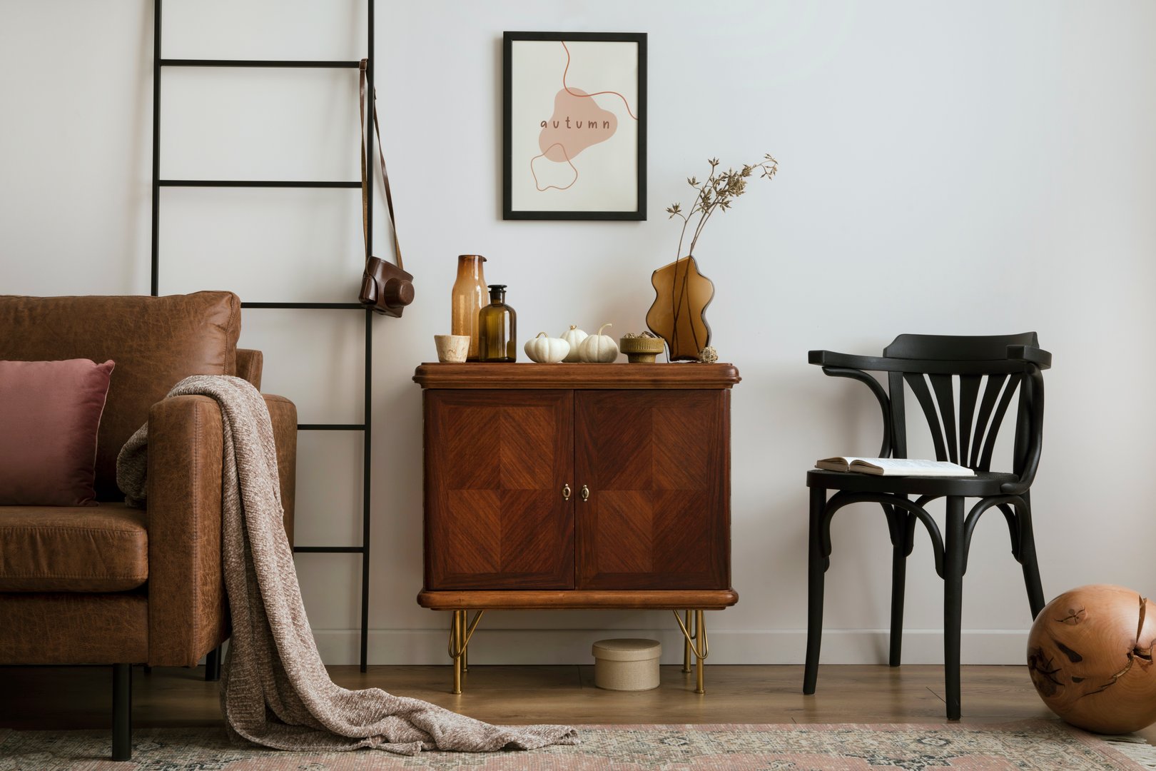 Warm and cozy living room interior with vintage sideboard