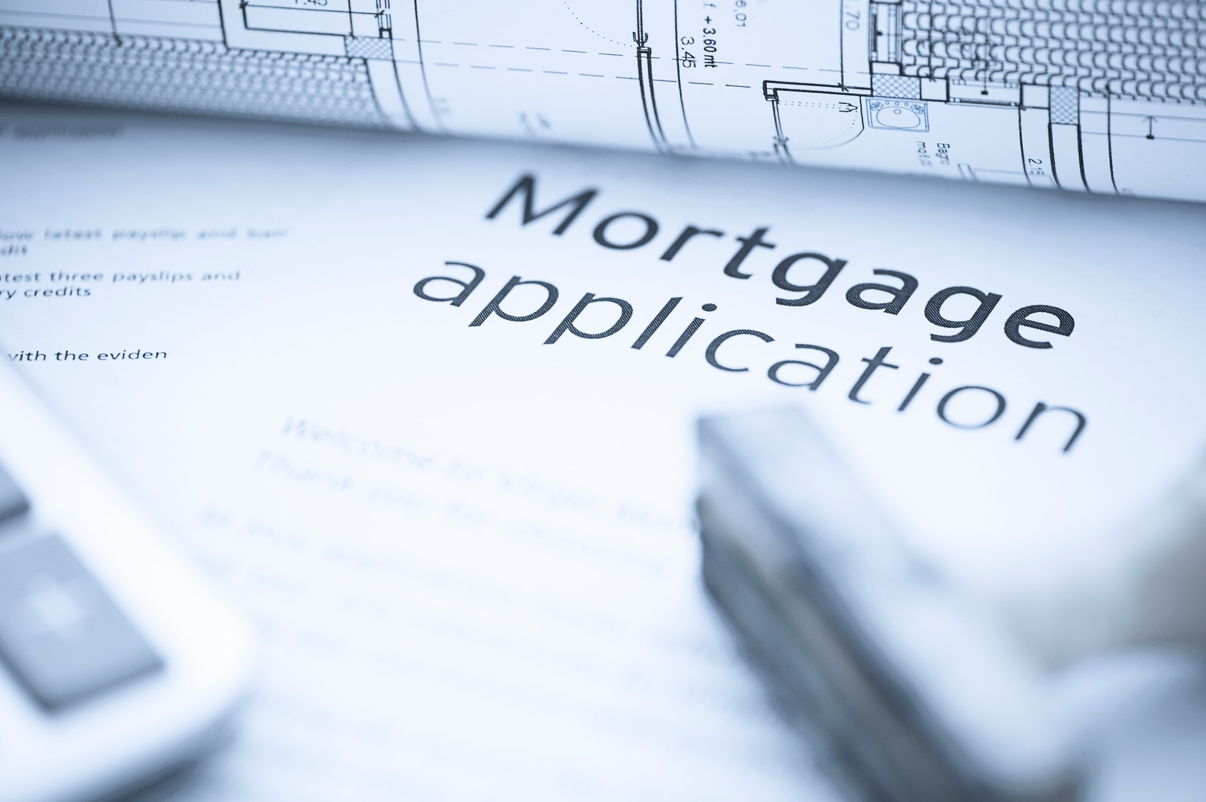 Mortgage application form with calculator and stamp for approving