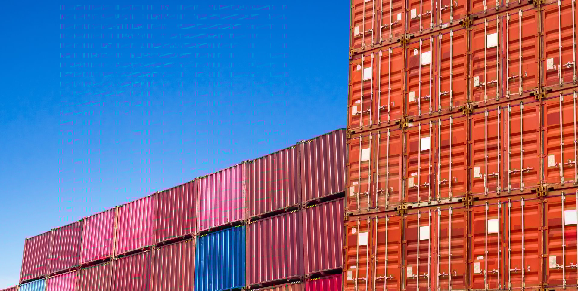 Container stack with blue sky background