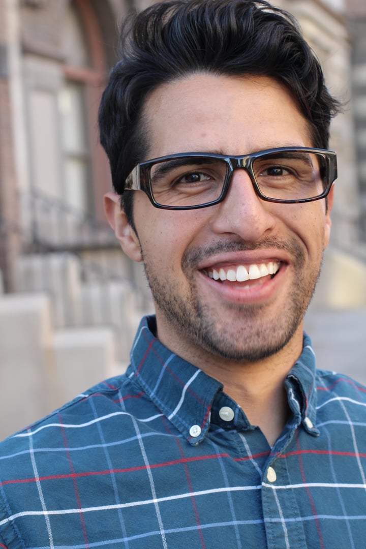 Vertical handsome smiling confident man portrait.