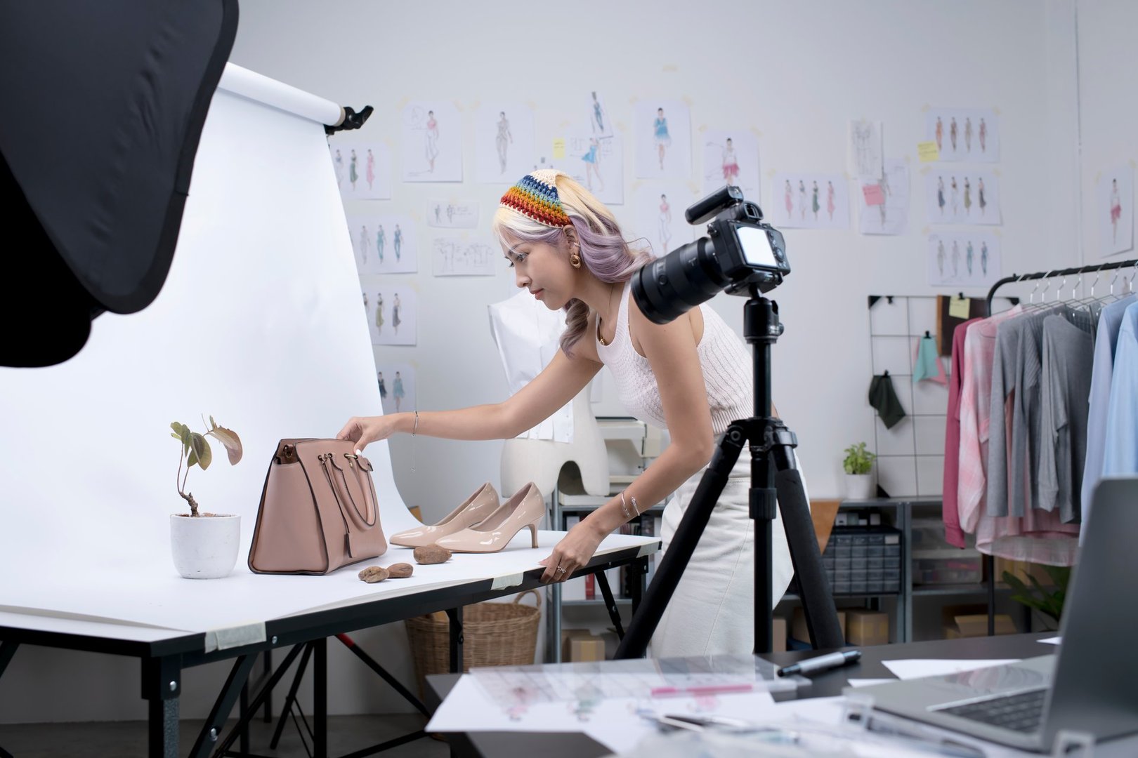 Asian woman fashion designer preparing for fashion photoshoot and product live streaming